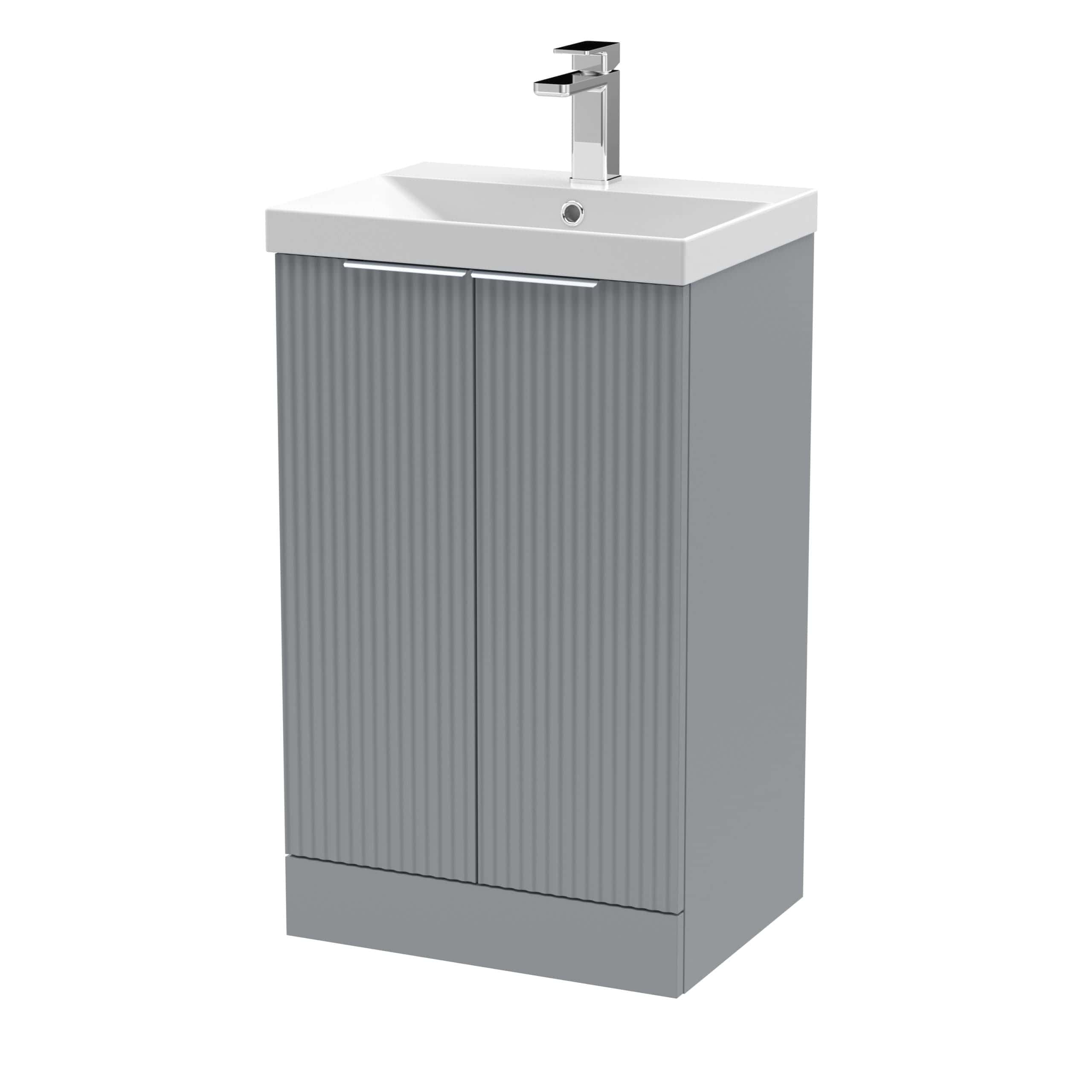Sleek grey bathroom vanity cabinet with a durable sink and modern chrome tap, ideal for contemporary bathroom designs focusing on functionality and aesthetics.