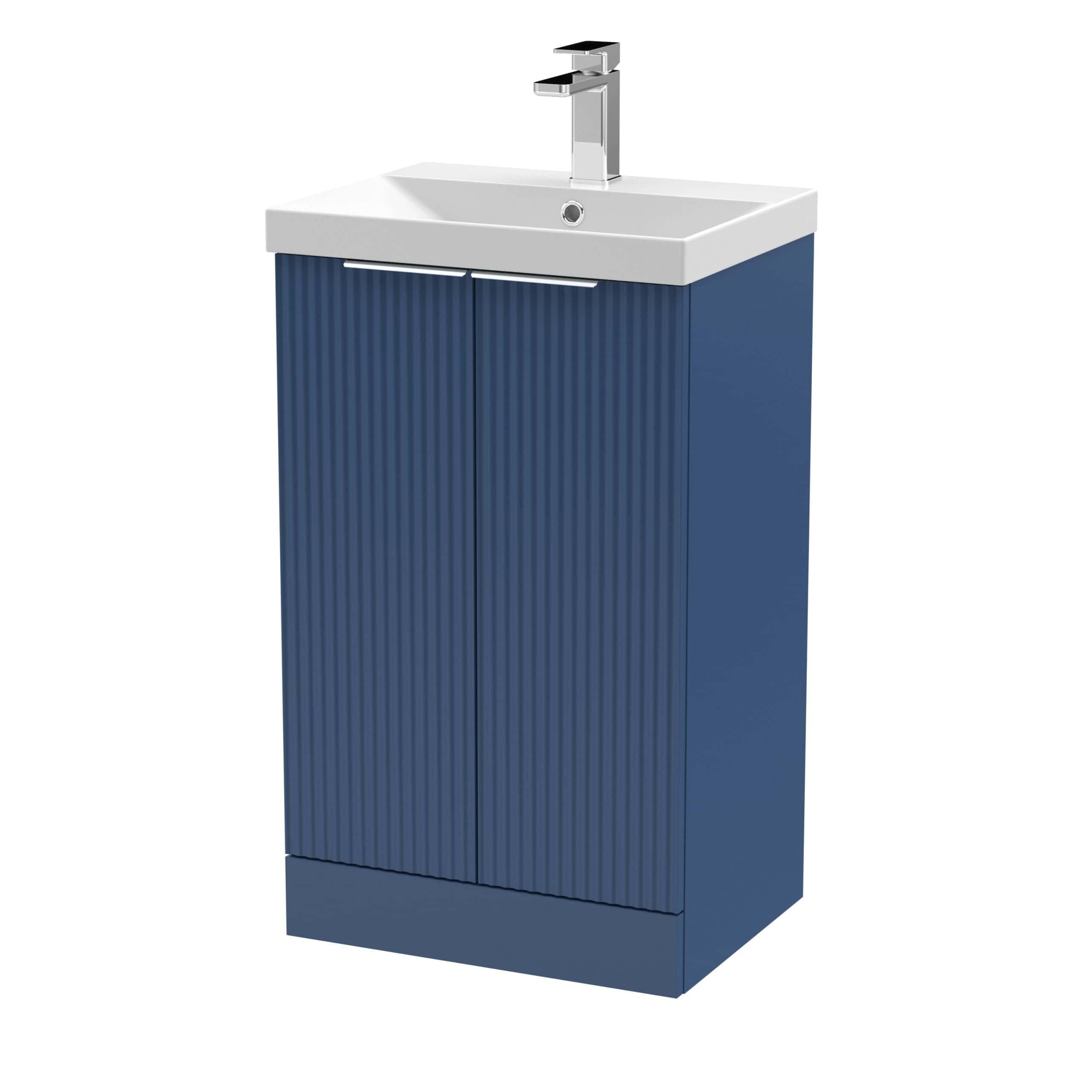 Modern bathroom vanity unit with integrated sink and chrome tap in navy blue colour, ideal for contemporary bathroom designs.