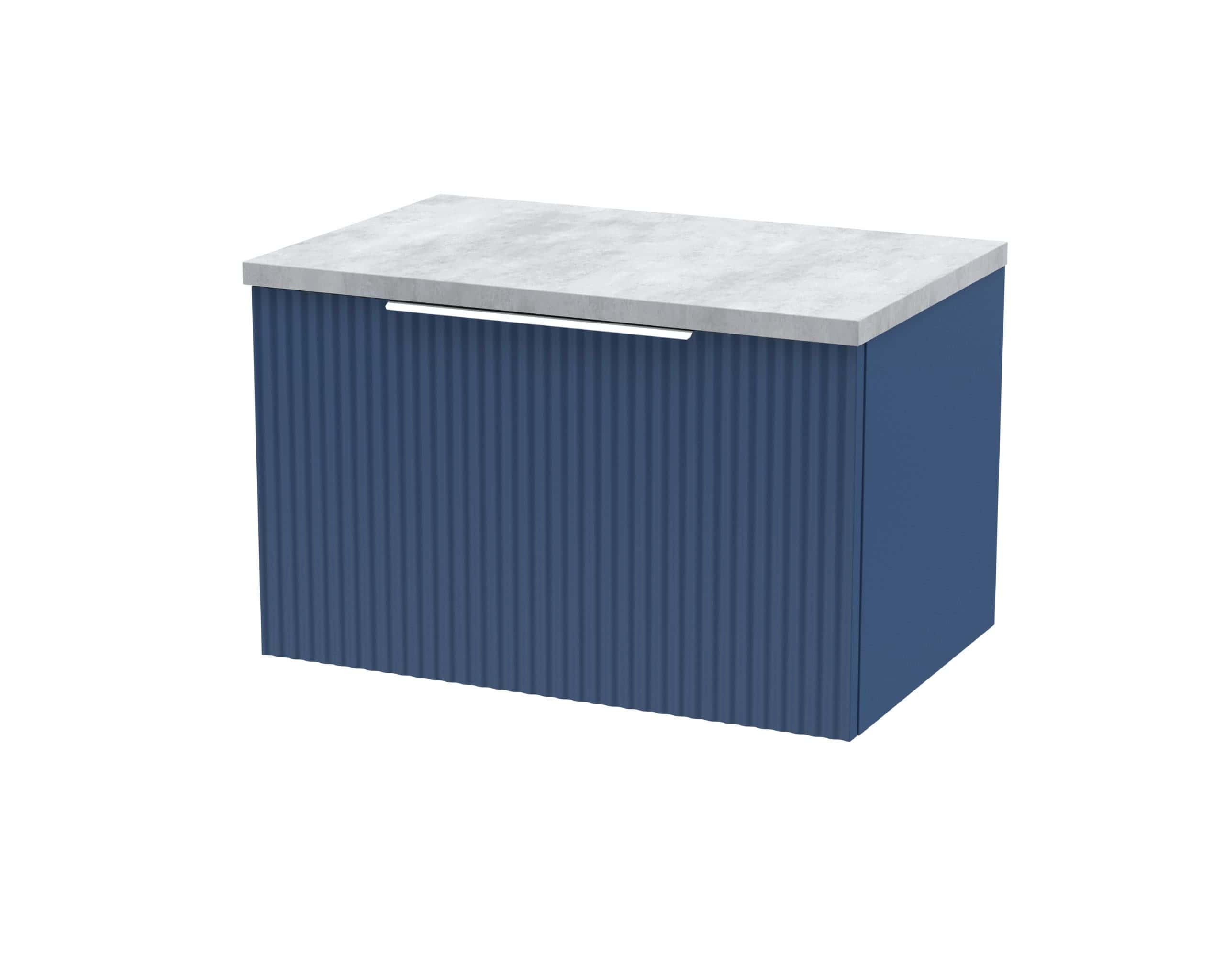 Bold blue bathroom cabinet with vertical ribbed detailing and a sleek marble top for modern bathroom storage solutions.