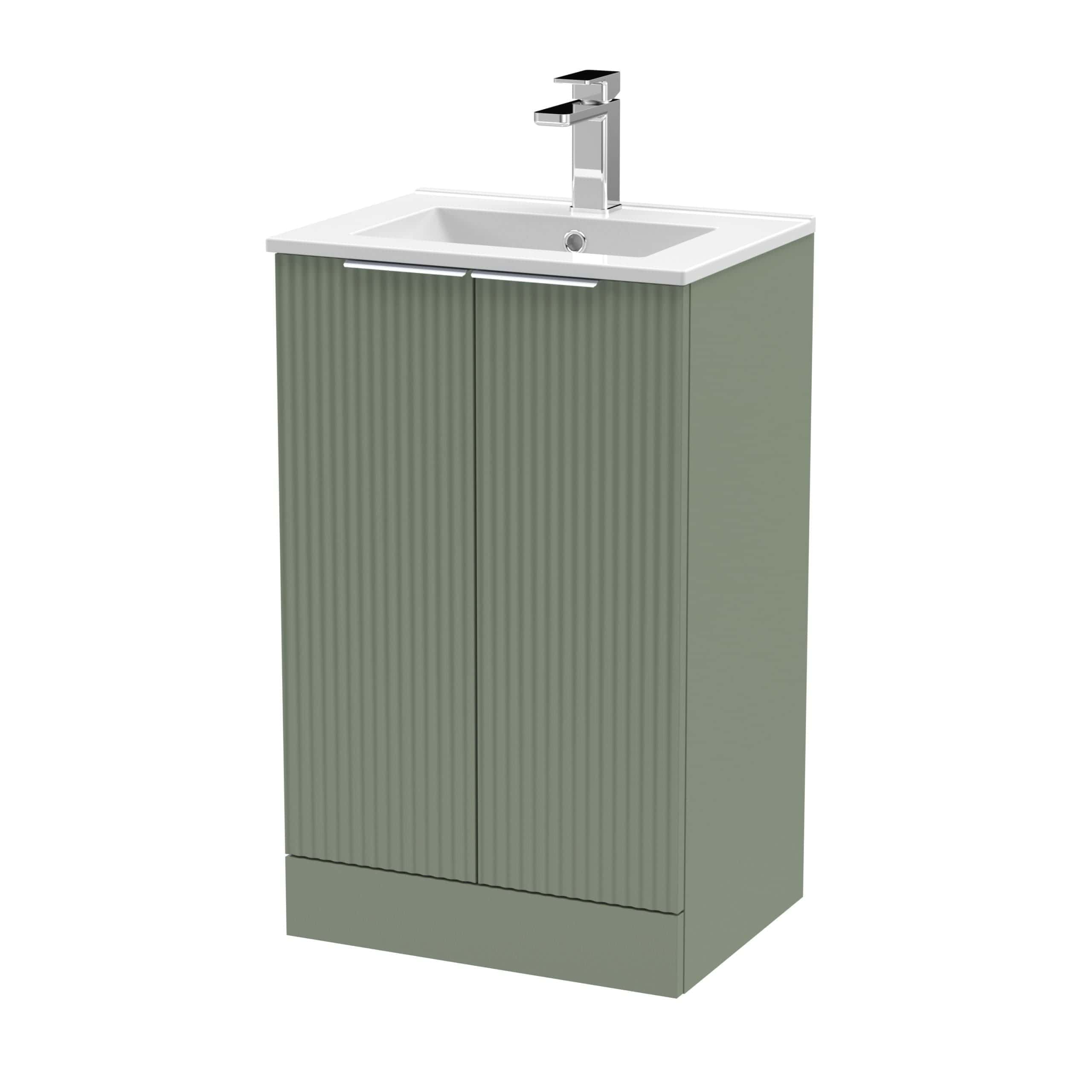 Modern green bathroom vanity with integrated sink and sleek chrome faucet, ideal for contemporary bathroom designs. Perfect for improving bathroom aesthetics and functionality.
