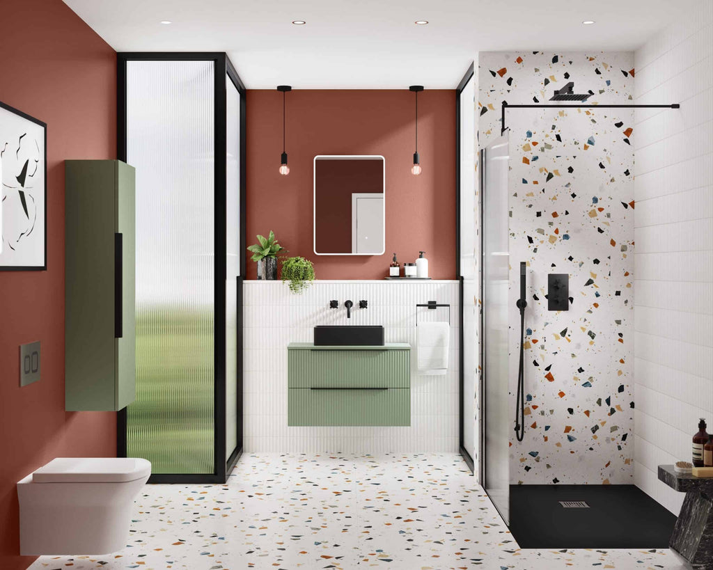 Modern bathroom design with terrazzo tiles, terracotta wall, black fixtures, green vanity unit, walk-in shower, and minimalist decor for stylish bathroom renovation.