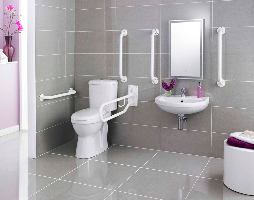 Anti-slip bathroom with accessible toilet and wall-mounted sink, featuring white grab bars for safety, grey tiled walls, and a sleek mirror; designed for accessible bathing and toilet use.