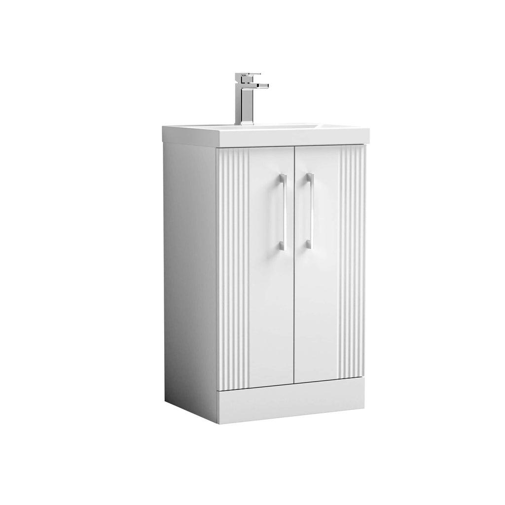 White bathroom vanity cabinet with a built-in sink and modern chrome faucet, ideal for contemporary bathroom design and storage solutions. Perfect for small to medium bathrooms.