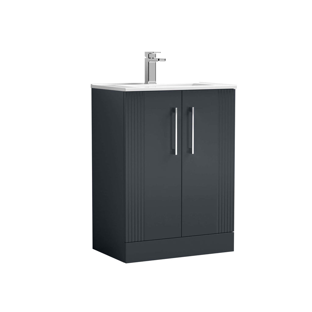 Modern black bathroom vanity unit with a white ceramic sink and chrome tap, ideal for contemporary bathrooms. Stylish storage solution with sleek handles and a ribbed drawer design.