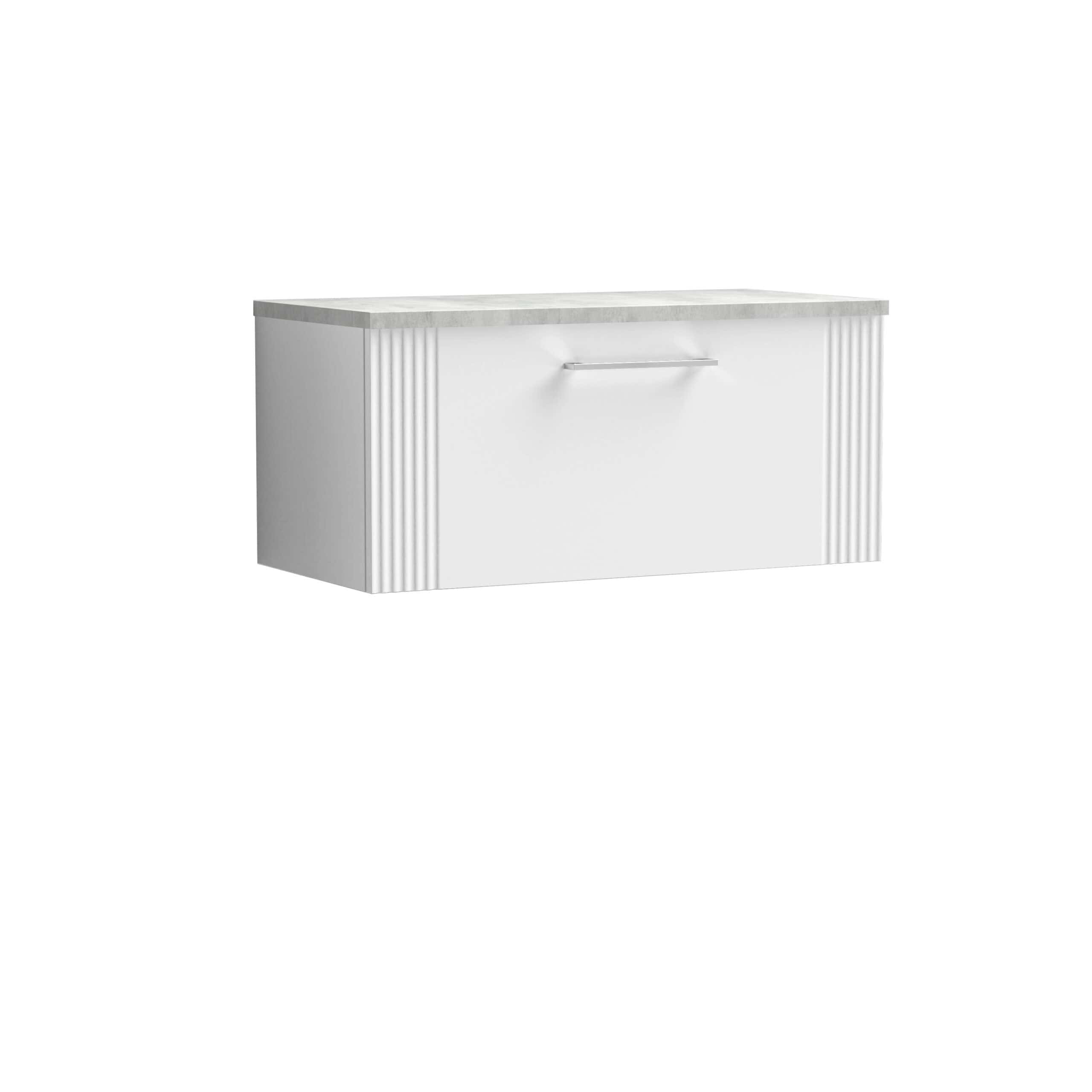 Slim modern bathroom vanity with a white finish and marble countertop, featuring a sleek drawer handle and decorative vertical ridges on the sides. Perfect for contemporary bathroom designs.