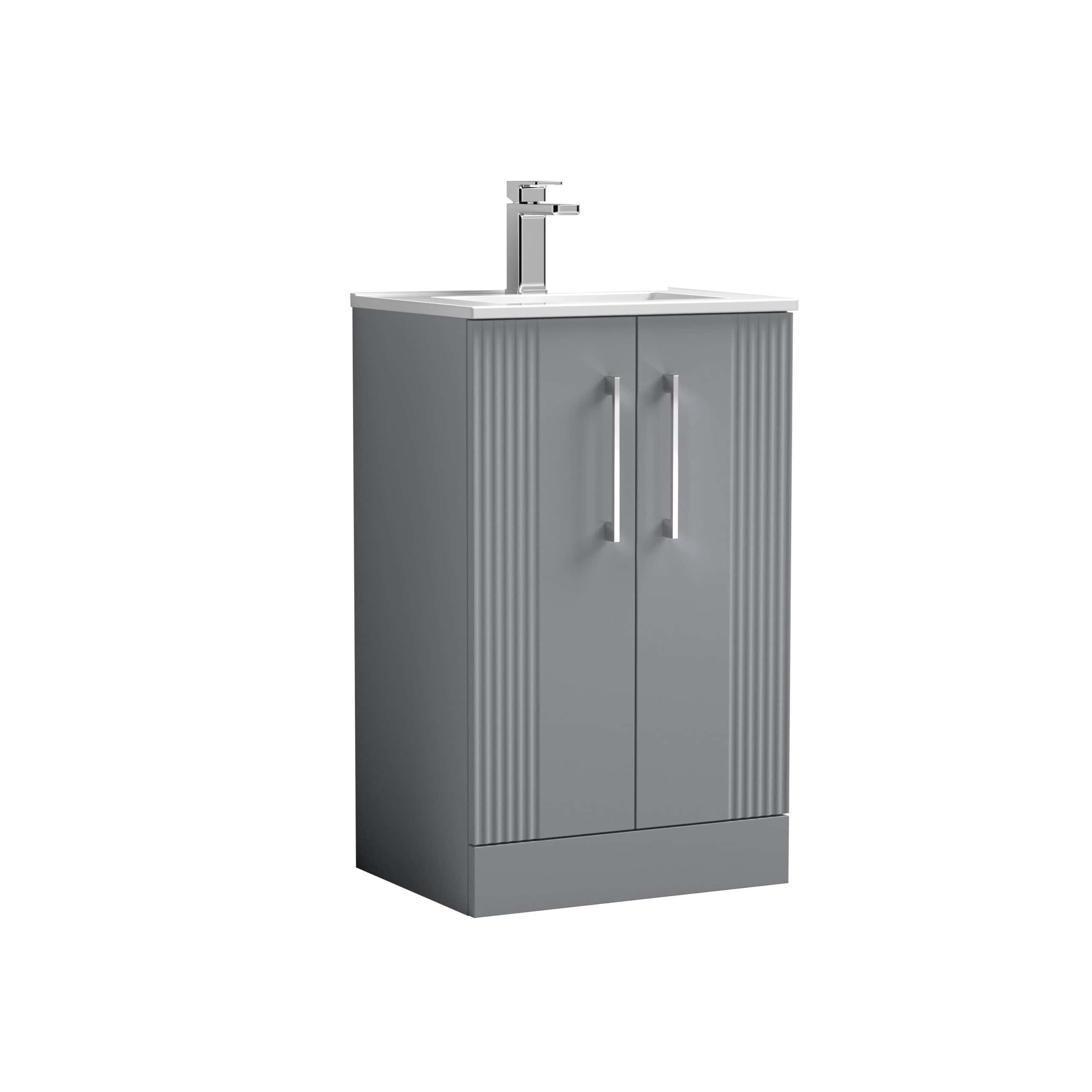 Modern grey bathroom vanity unit with a integrated basin and chrome tap, ideal for contemporary bathroom decor and storage solutions. Perfect for enhancing bathroom functionality and style.
