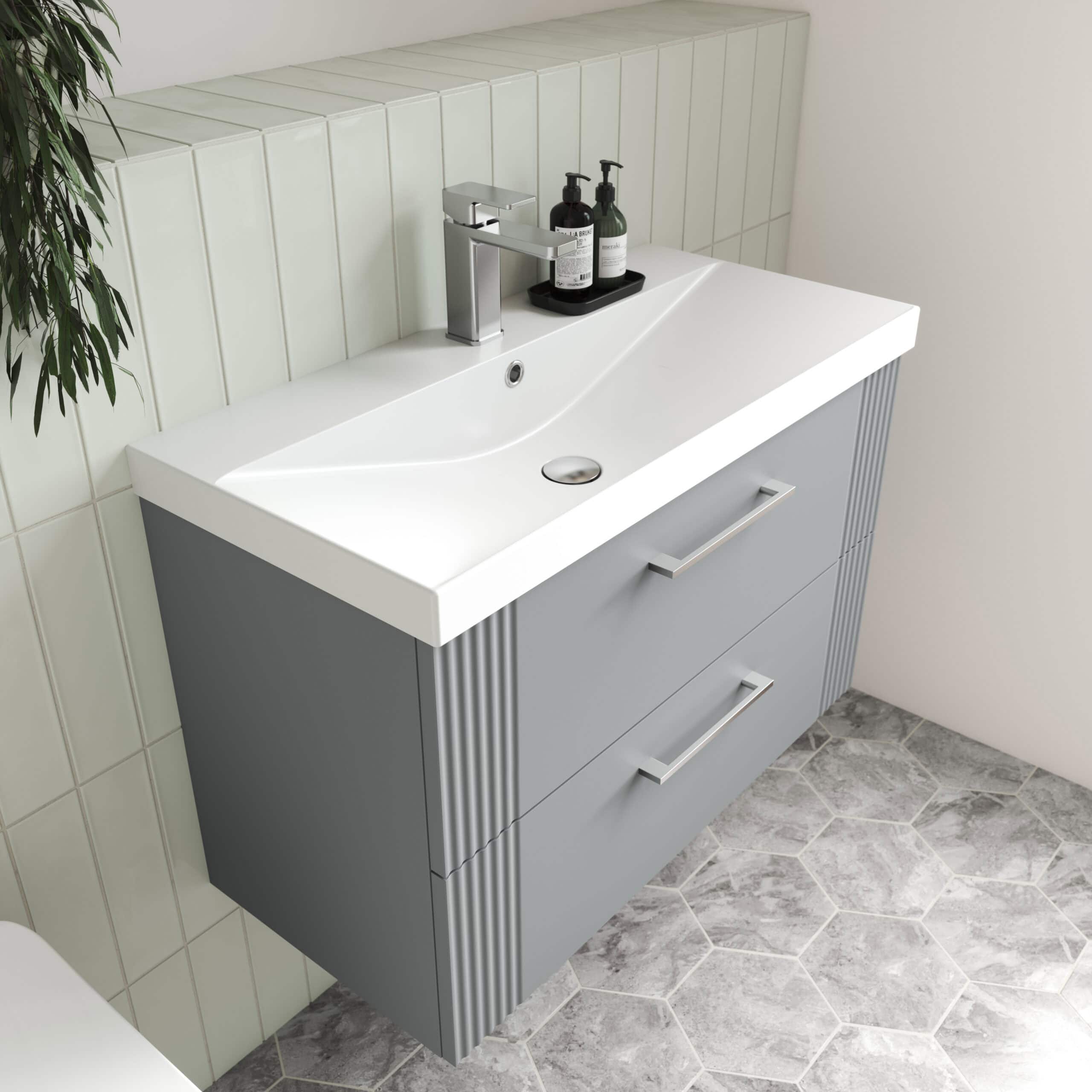 Sleek modern bathroom vanity with integrated sink, grey finish, and stylish cabinet drawers for ample storage, perfect for contemporary bathroom interiors.