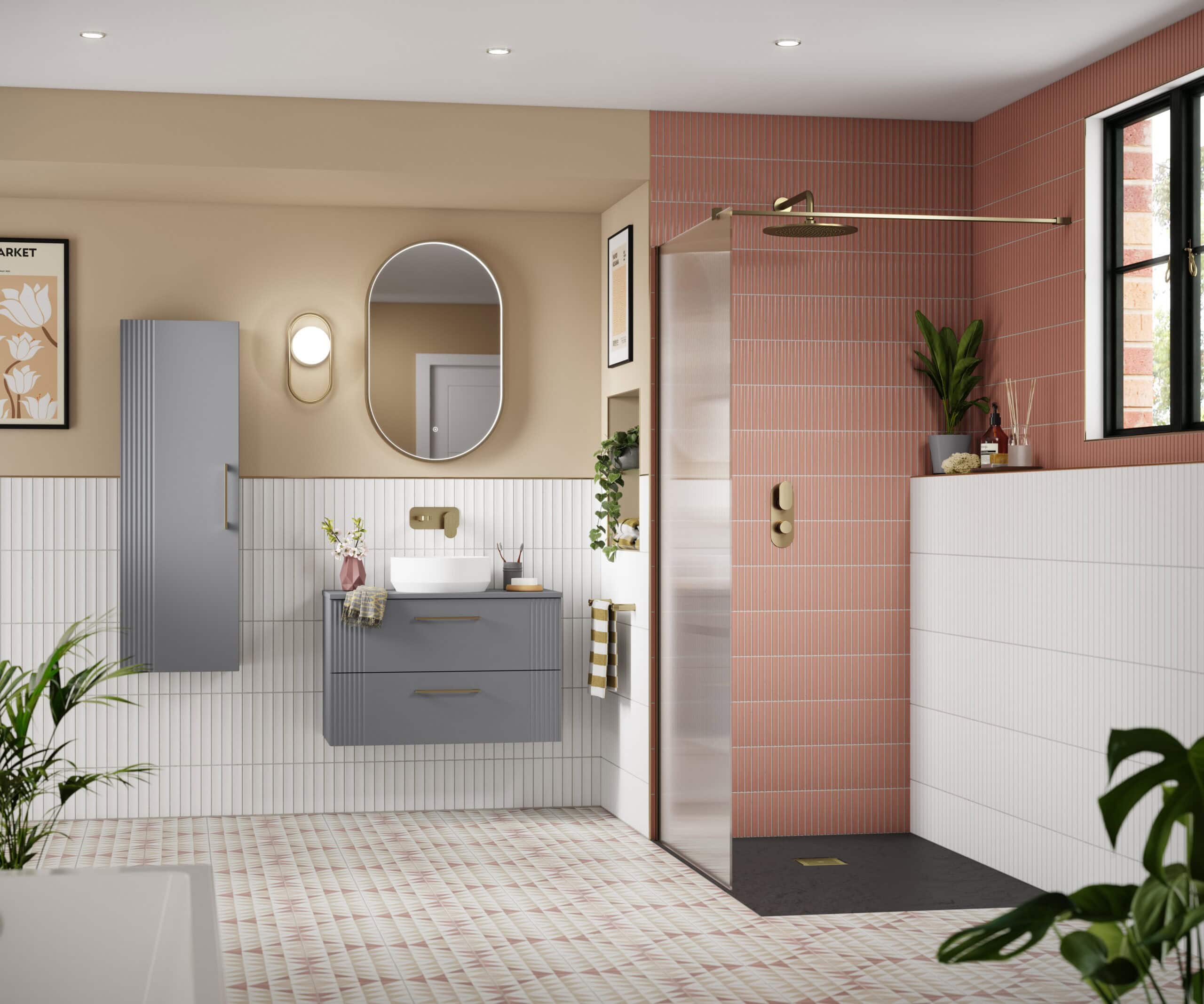 Modern bathroom with a stylish grey vanity, oval mirror, and a walk-in shower featuring pink tiles and black flooring, accented with green plants and contemporary fixtures.