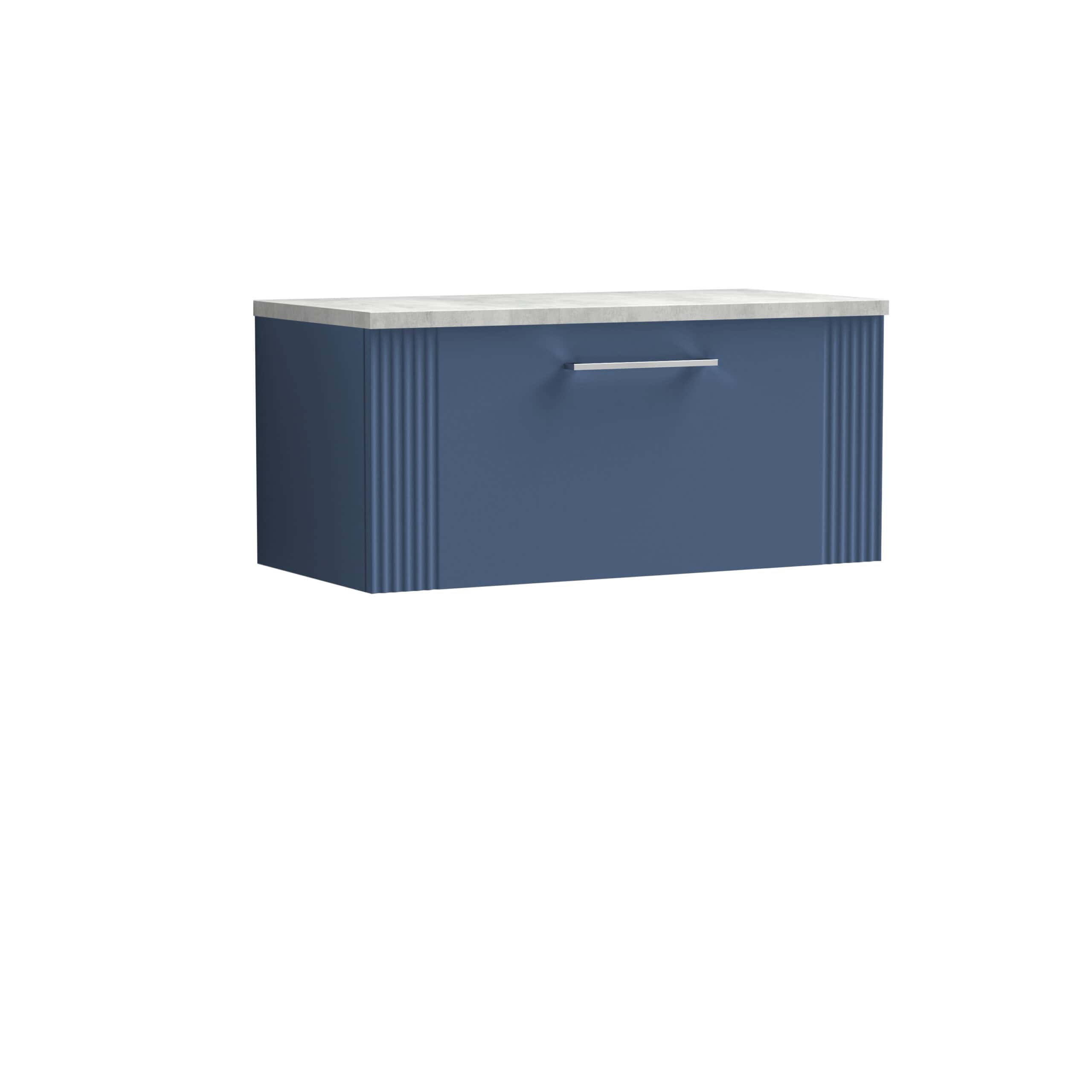 Modern navy blue bathroom cabinet with a marble top and textured vertical panel details, ideal for stylish bathroom storage solutions.