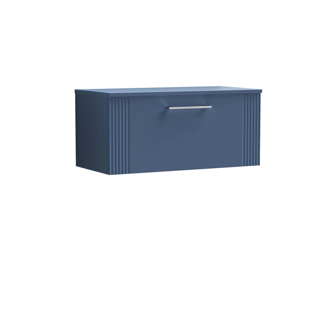 Sleek blue bathroom vanity with ribbed sides and a modern brushed chrome handle, ideal for contemporary bathroom storage solutions.