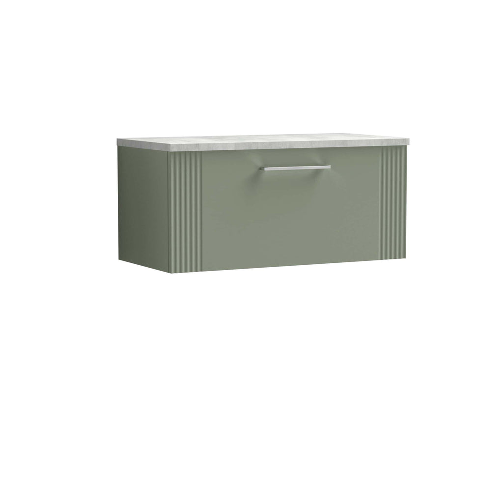 Clean modern bathroom vanity with a pastel green cabinet, vertical ribbed design details, and a sleek silver handle, topped with a marble countertop, ideal for contemporary bathroom decor.
