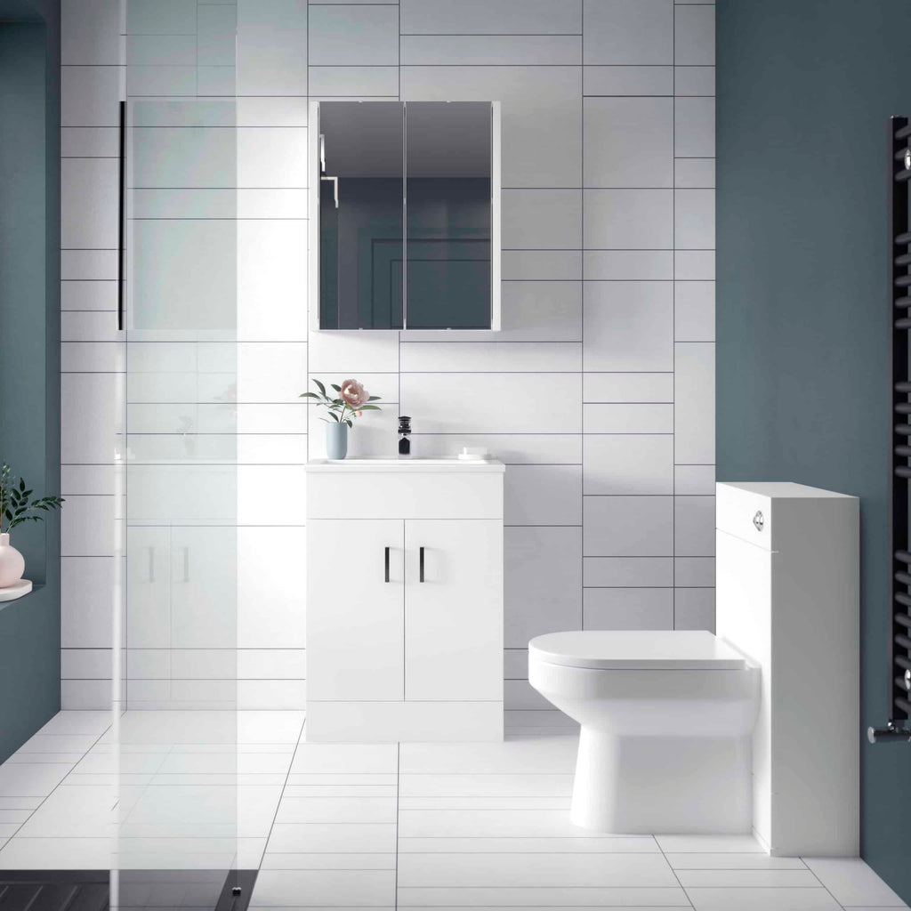 Modern minimalistic bathroom with white fixtures, sleek vanity unit, and contemporary mirror - ideal for stylish bedroom bathrooms.