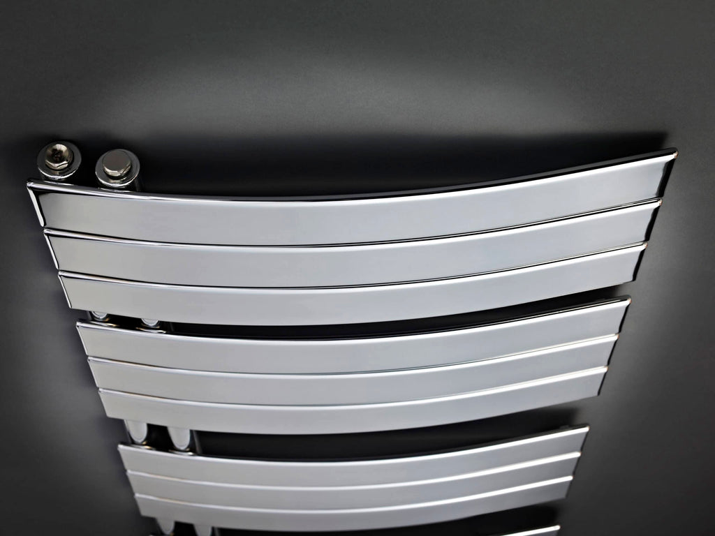 Polished chrome towel radiator in modern bathroom, perfect for warming towels and adding sleek style to bathroom decor.