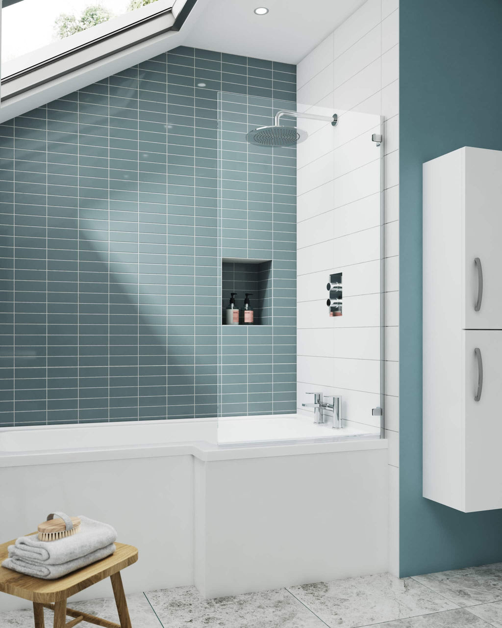 Contemporary bathroom with blue and white tiled shower area, built-in shelf, skylight, and modern fixtures. Stylish and functional bathroom design by Bubly Bathrooms in the UK.