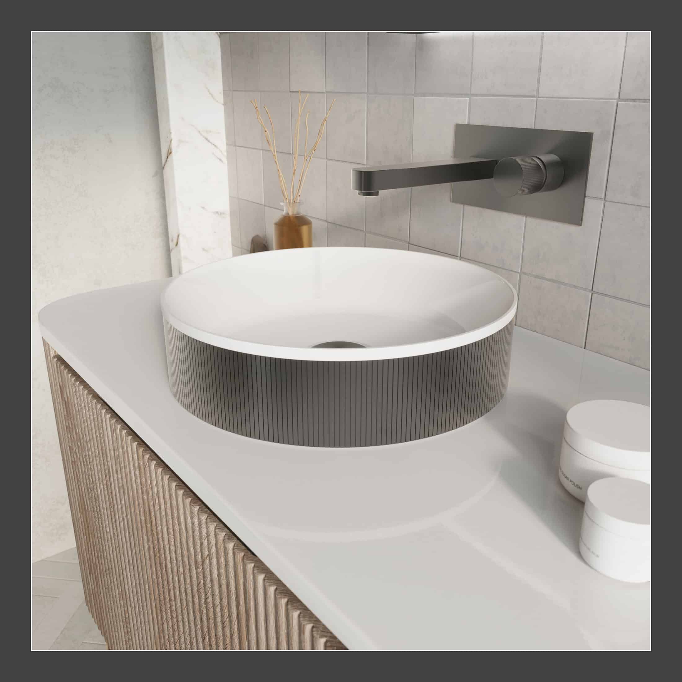 Sleek modern bathroom sink with a round vessel basin, wall-mounted matte black faucet, and minimalist decor, ideal for contemporary bathroom designs.