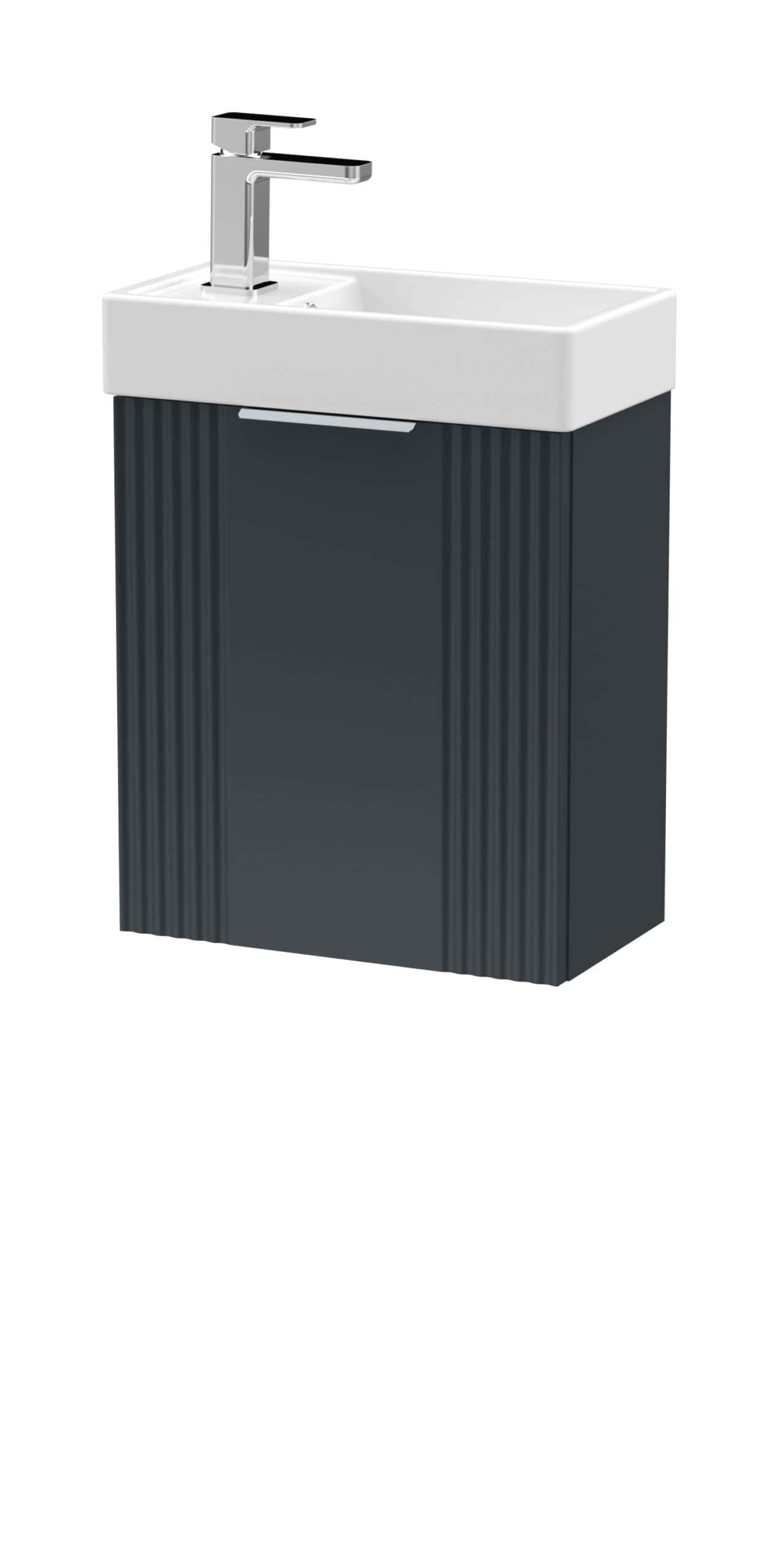 Sleek bathroom sink with black vanity unit and modern chrome tap, ideal for contemporary bathroom designs.