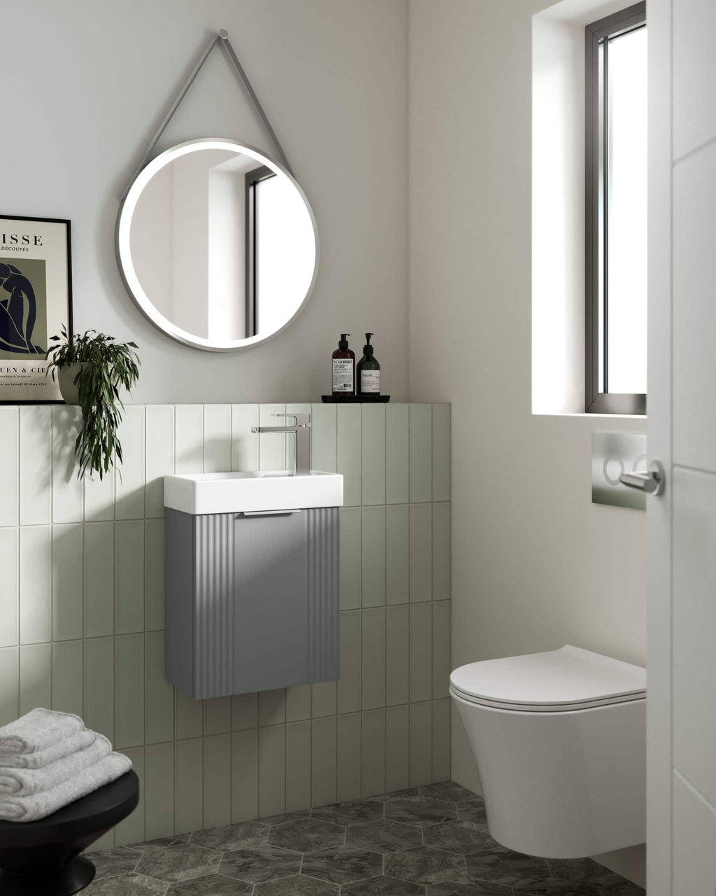 Smart modern bathroom featuring a sleek wall-mounted sink vanity, illuminated round mirror, minimalistic decor, and contemporary toilet, highlighting innovative bubly bathroom design ideas.