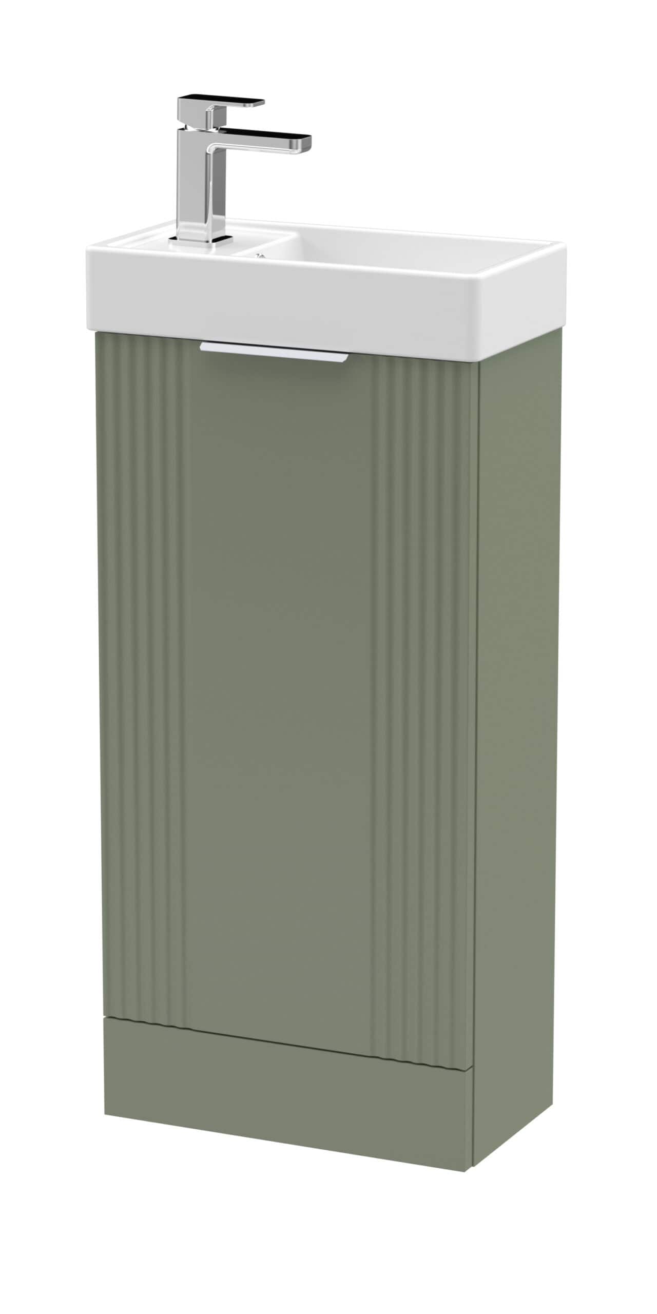 Modern bathroom vanity with a white ceramic sink and sleek chrome faucet, set against a stylish green cabinet with vertical ribbed detailing for contemporary bathroom design.