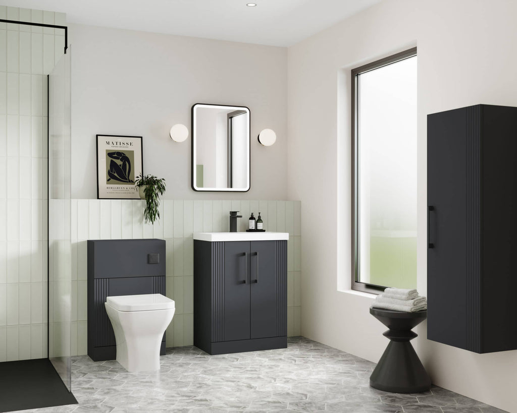 Sleek modern bathroom featuring Bubly Bathrooms' black fixtures, wall-mounted toilet, vanity unit, large window with natural light, stylish mirror, and minimalist design for contemporary bathroom decor.