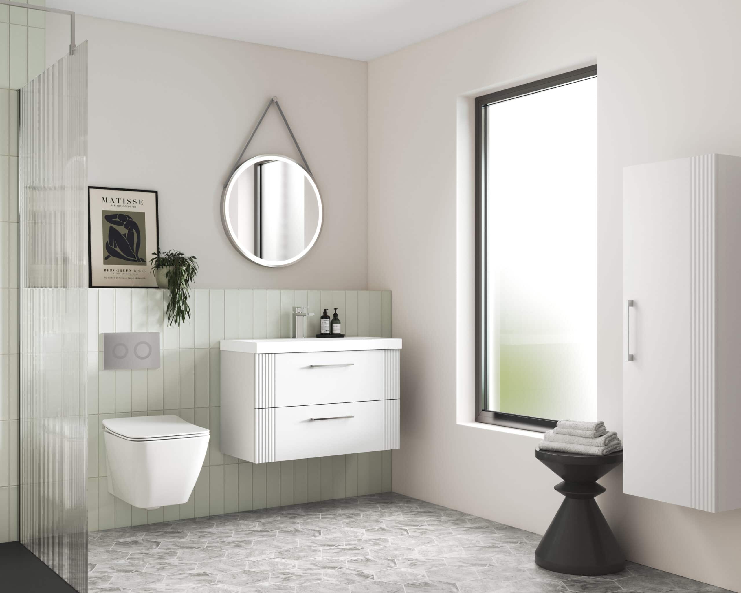 Modern minimalistic bathroom with white vanity unit, wall-mounted toilet, round illuminated mirror, frosted glass window, and stylish accessories; perfect for contemporary bathroom design.