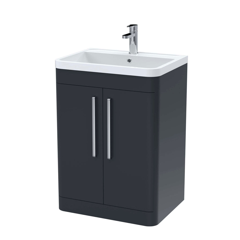 Modern bathroom vanity with integrated sink and chrome faucet, ideal for contemporary bathroom designs. Featuring sleek dark grey cabinetry with two handles for storage and durability.