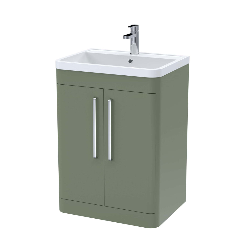 Modern bathroom vanity with a white ceramic sink and green MDF cabinet featuring silver handles, ideal for contemporary bathroom designs.
