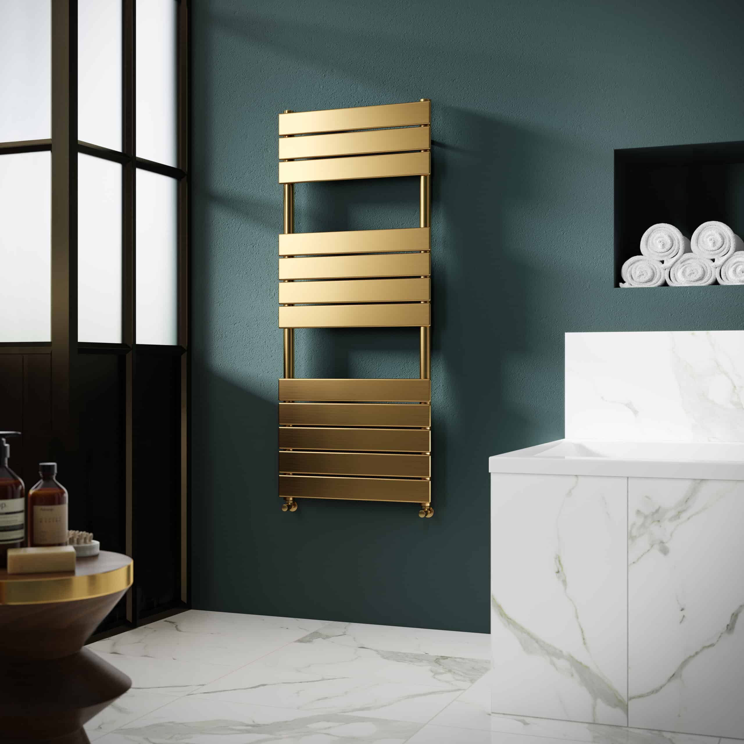 Sleek gold towel radiator mounted on a dark teal bathroom wall with marble flooring and a marble vanity unit, creating a luxurious and modern bathroom design.