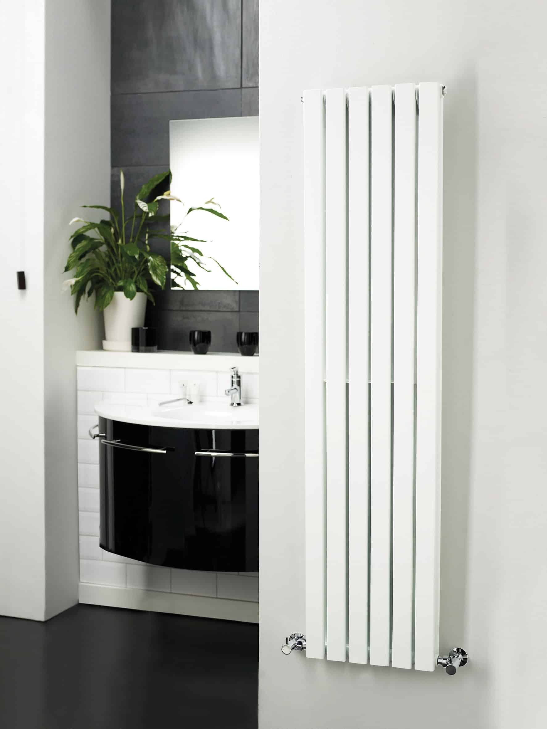 Modern white vertical radiator in contemporary bathroom with sleek design, perfect for stylish heating solutions and enhancing bathroom aesthetics.