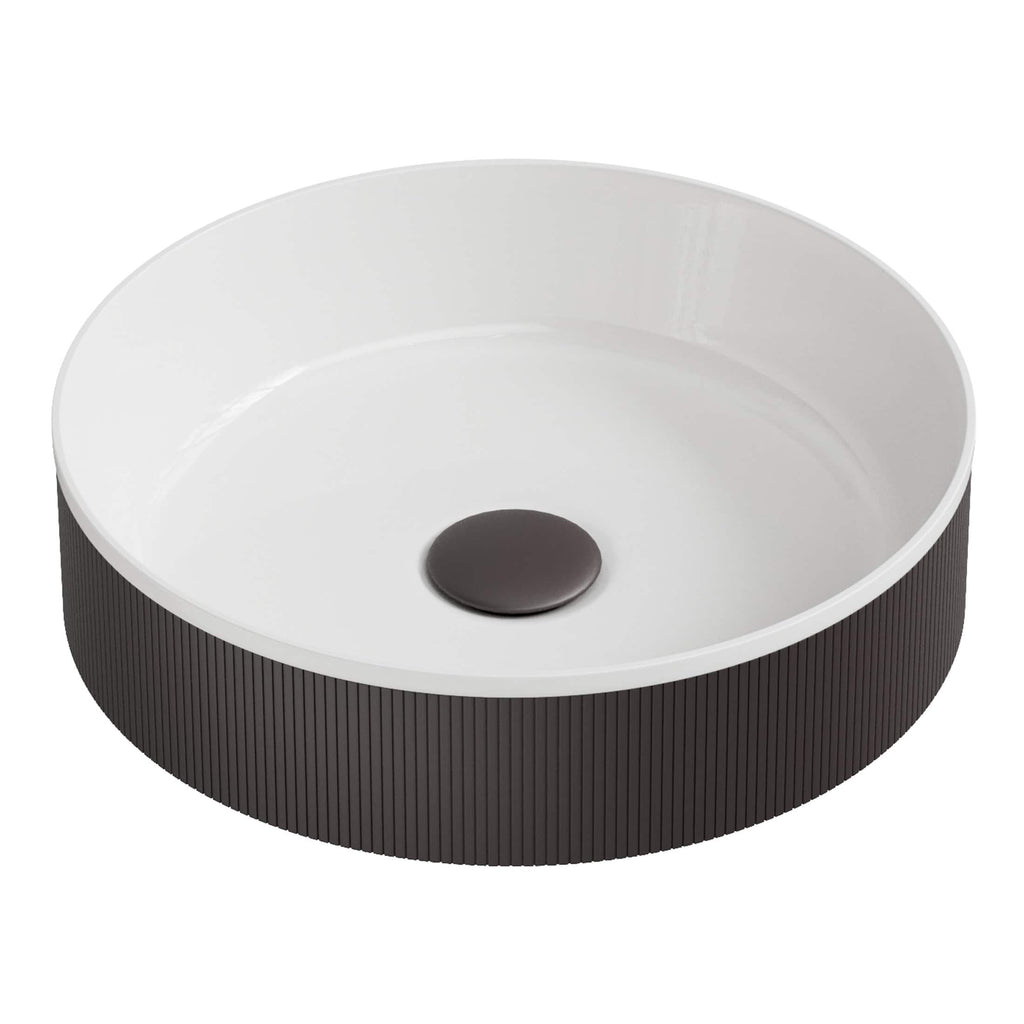 Sleek modern bathroom sink with black textured exterior and smooth white interior, featuring a central drain cap, ideal for contemporary bathroom designs.