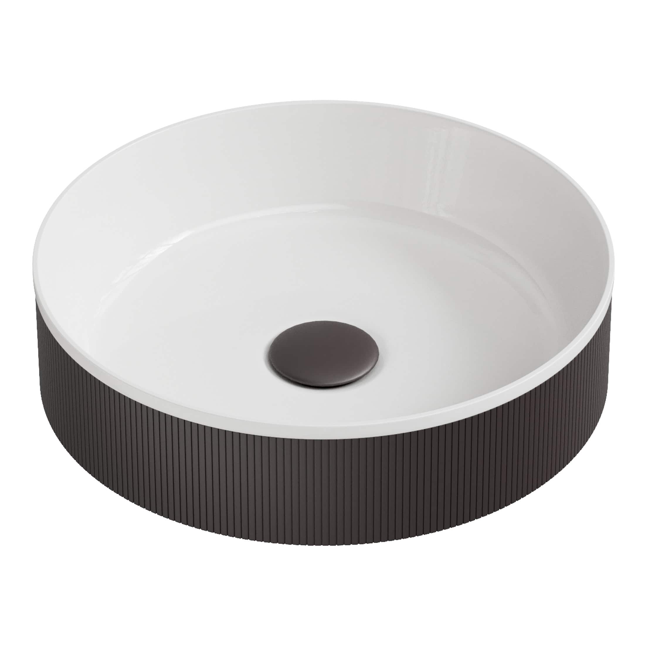 Sleek modern bathroom sink with black textured exterior and smooth white interior, featuring a central drain cap, ideal for contemporary bathroom designs.