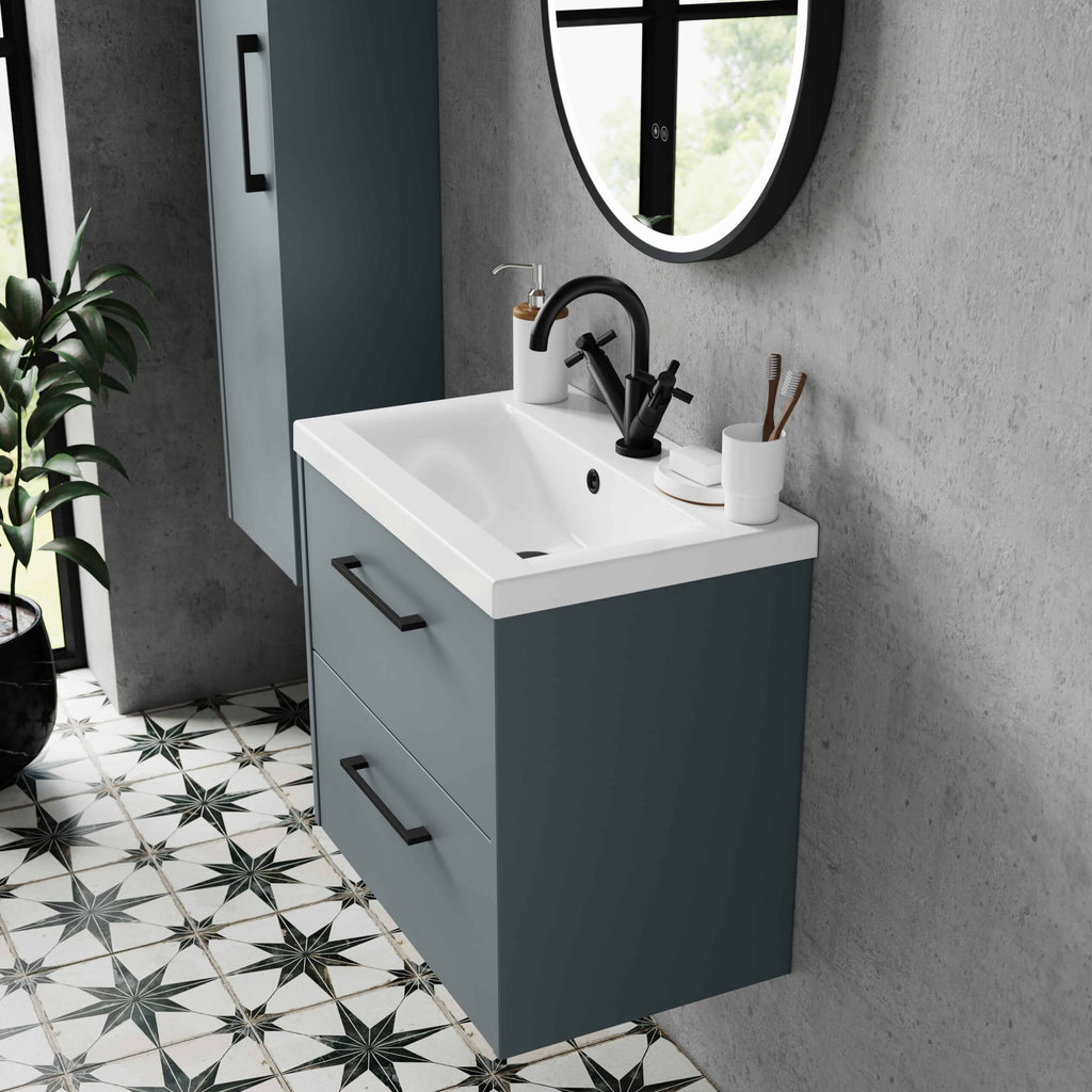 Sleek modern bathroom vanity unit with black fixtures and a stylish mirror, featuring a white sink for contemporary bathroom decor.