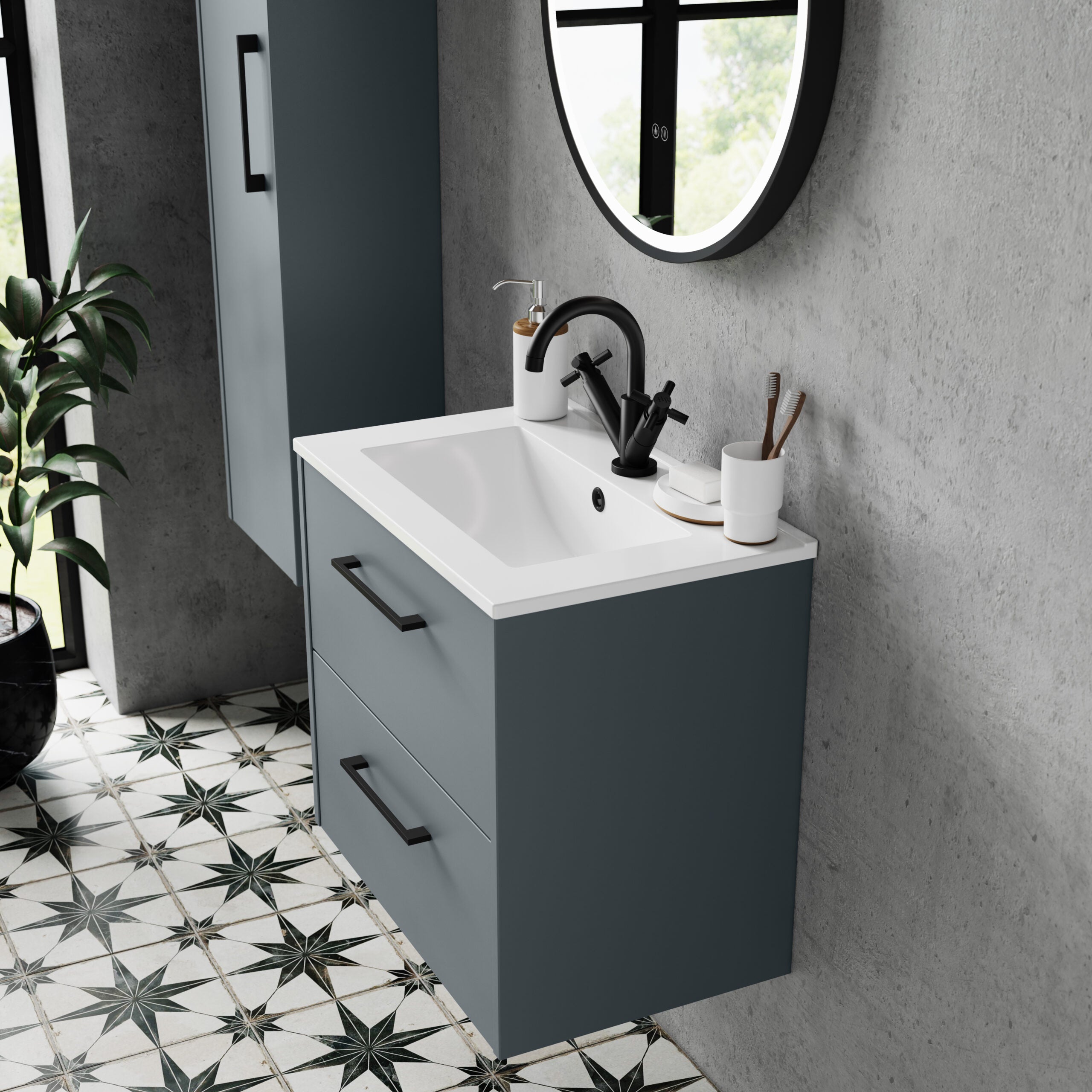 Sleek modern bathroom vanity with a blue-grey cabinet, white sink, black tap, and round mirror, showcasing contemporary bathroom design.
