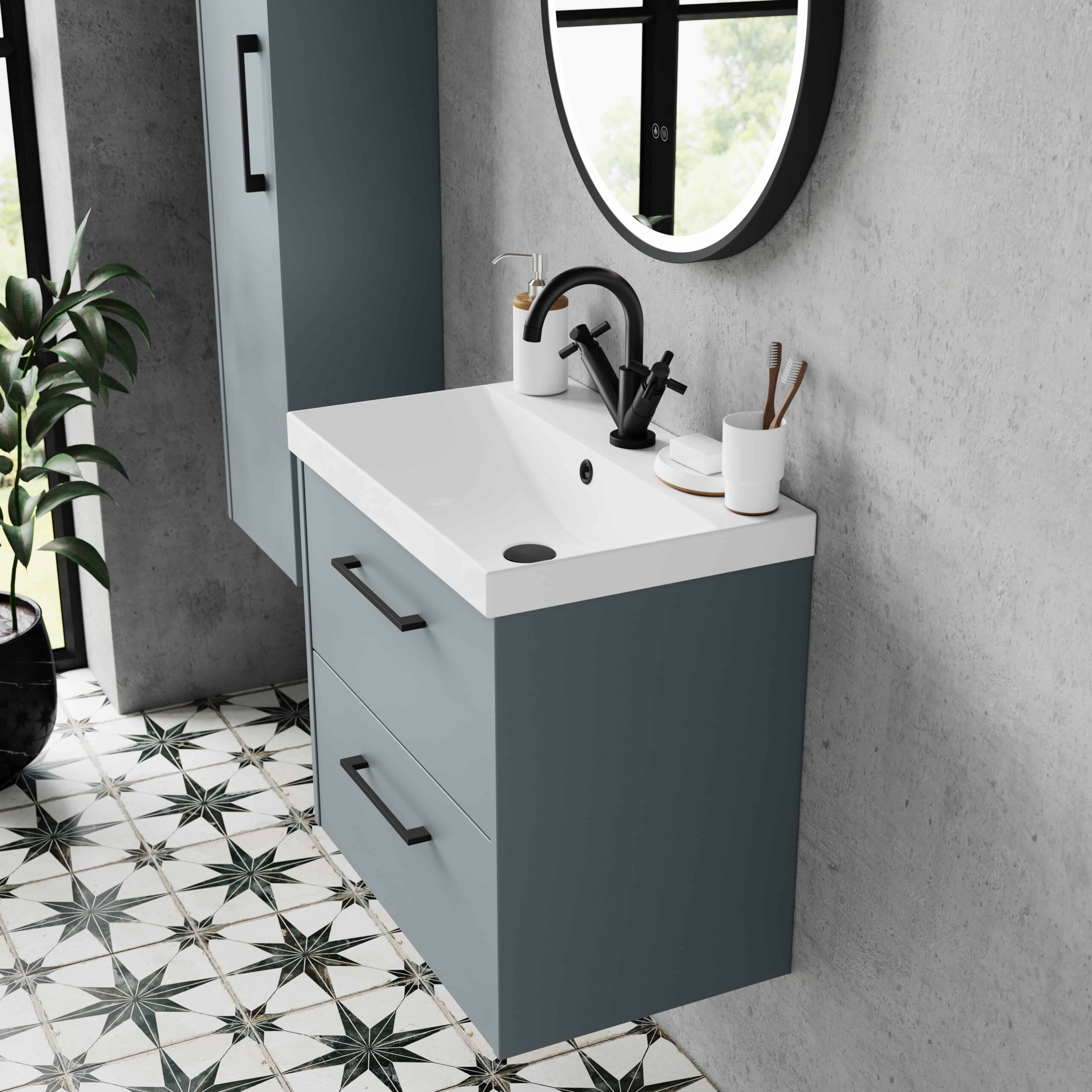 Sleek blue bathroom vanity with white ceramic sink, black tap, and mirror, set against a concrete wall with decorative tiled floor, showcasing modern bathroom design and fixtures.