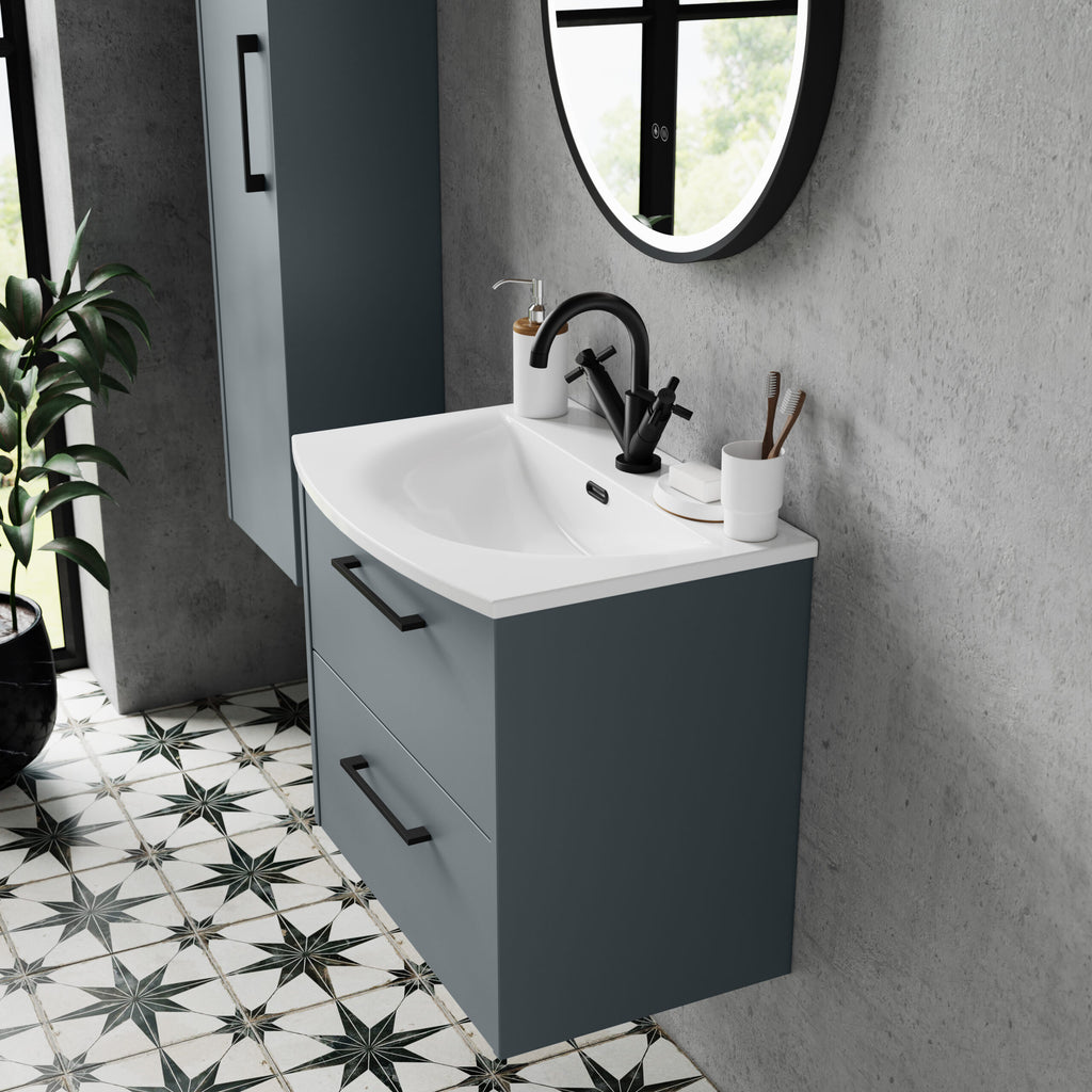 Contemporary grey bathroom vanity with integrated sink and black faucet, set against textured grey wall with minimal accessories, enhancing modern bathroom aesthetics.
