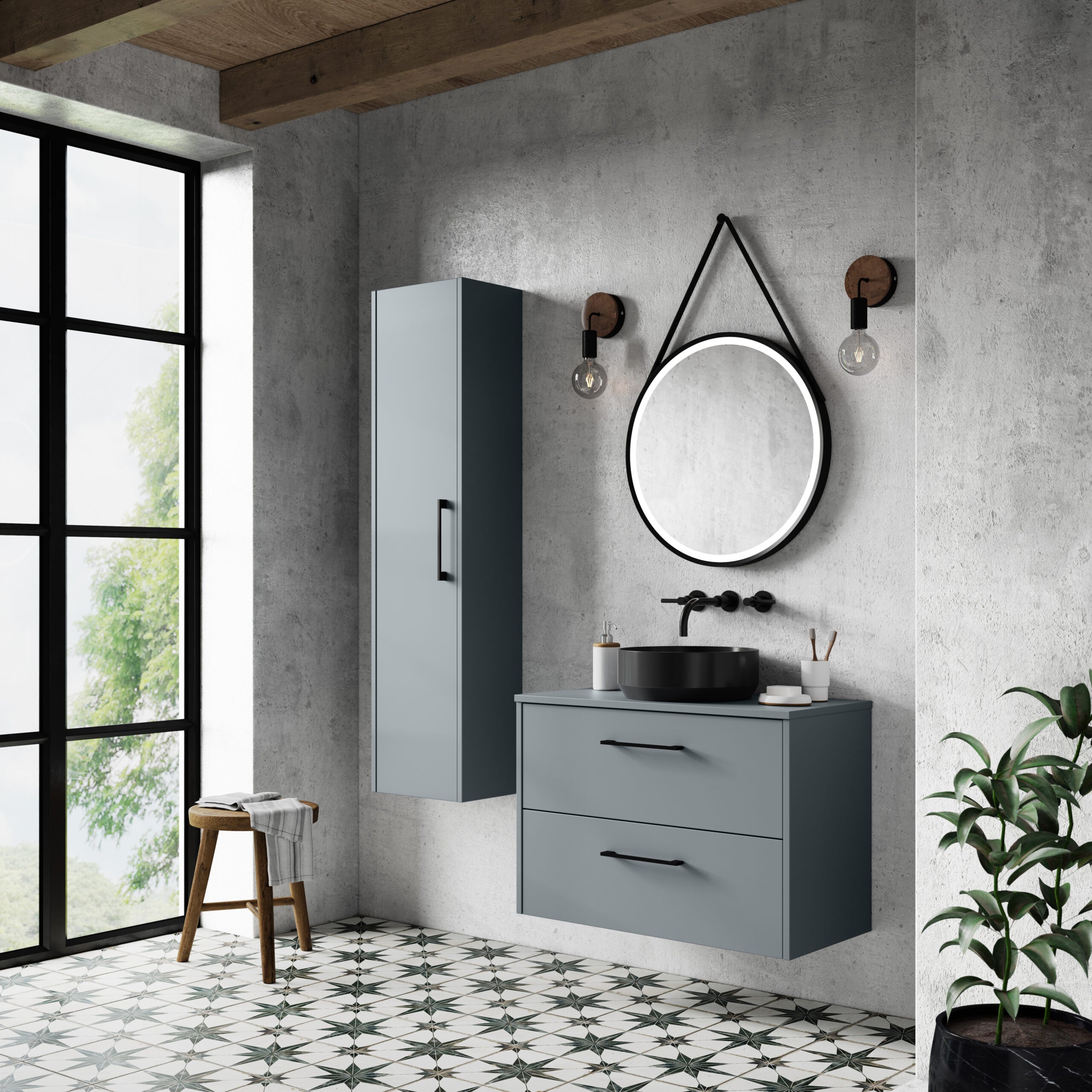 Modern bathroom vanity set with circular mirror, black vessel sink, and sleek cabinetry in a minimalist industrial-style space featuring natural light through black-framed window.