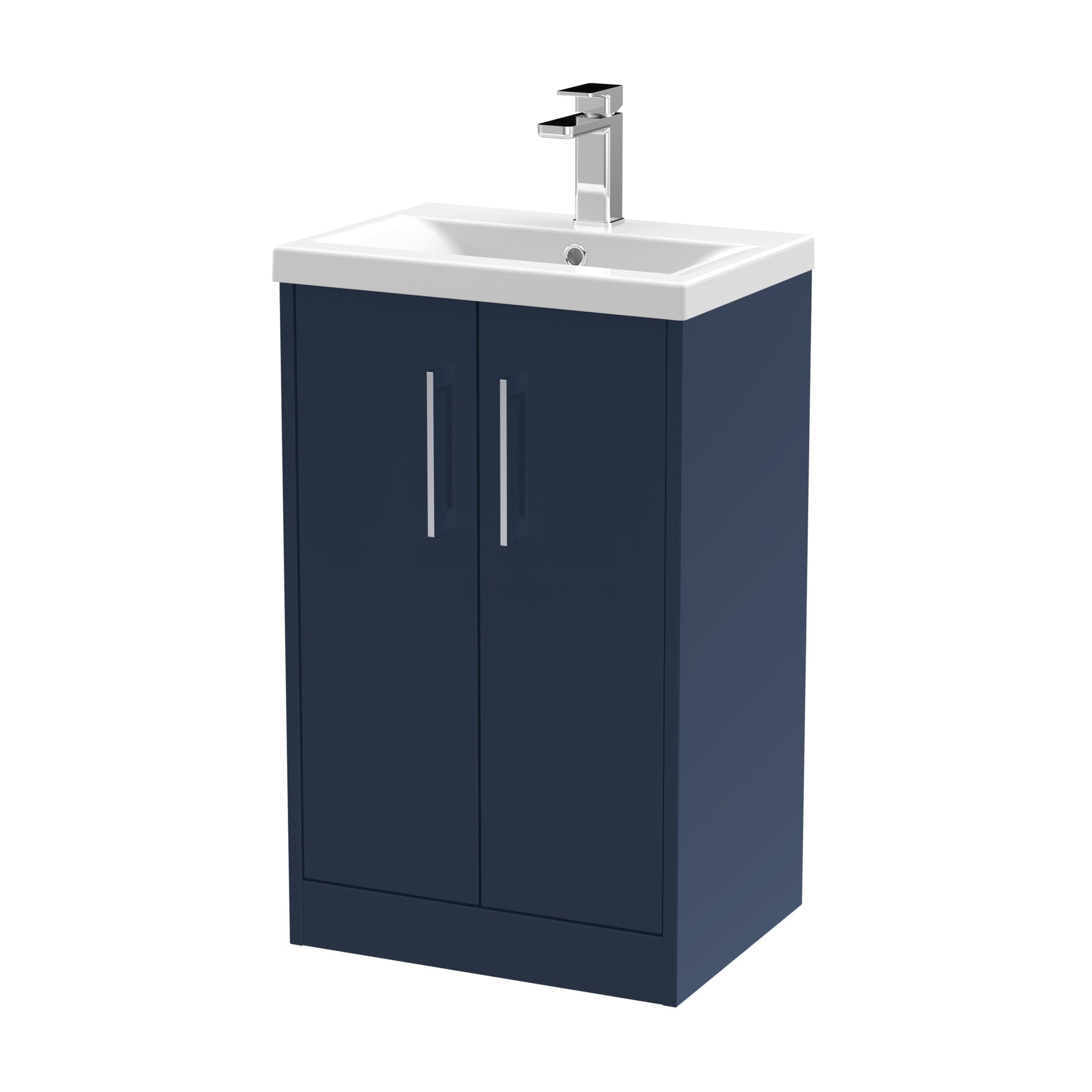 Sleek navy bathroom cabinet with integrated sink and modern chrome tap, perfect for contemporary bathroom storage and vanity solutions.
