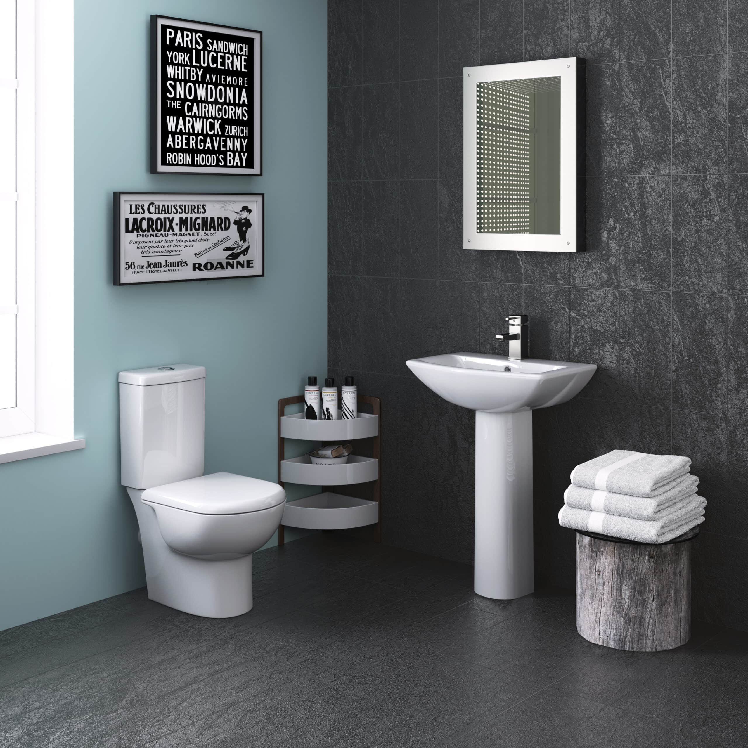 Modern bathroom with white toilet, pedestal sink, black textured wall tiles, and stylish decor, perfect for contemporary bathroom renovations and fittings.