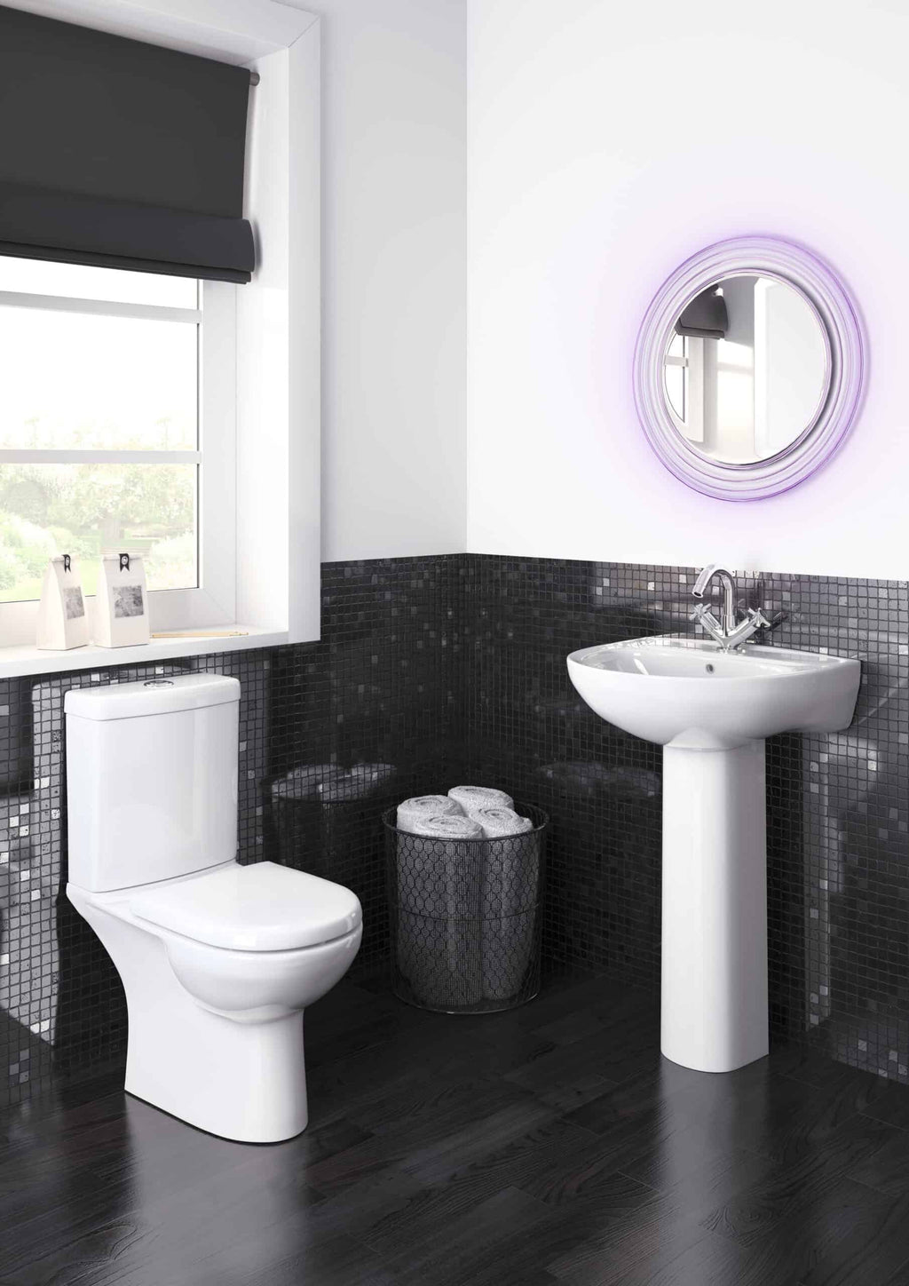 Modern bathroom with white toilet and sink, black mosaic tiles, circular illuminated mirror, and stylish black window blind, showcasing contemporary Bubly Bathrooms design.
