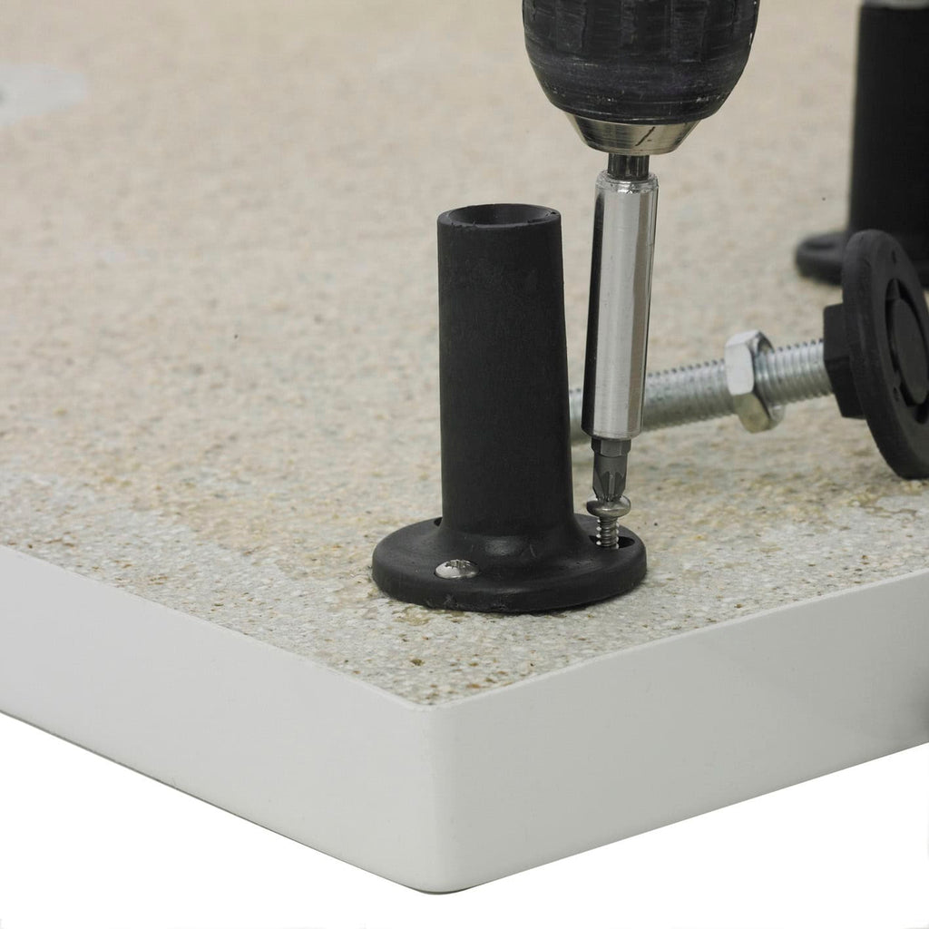 Screwdriver installing adjustable bathroom furniture stability foot on bathroom countertop.