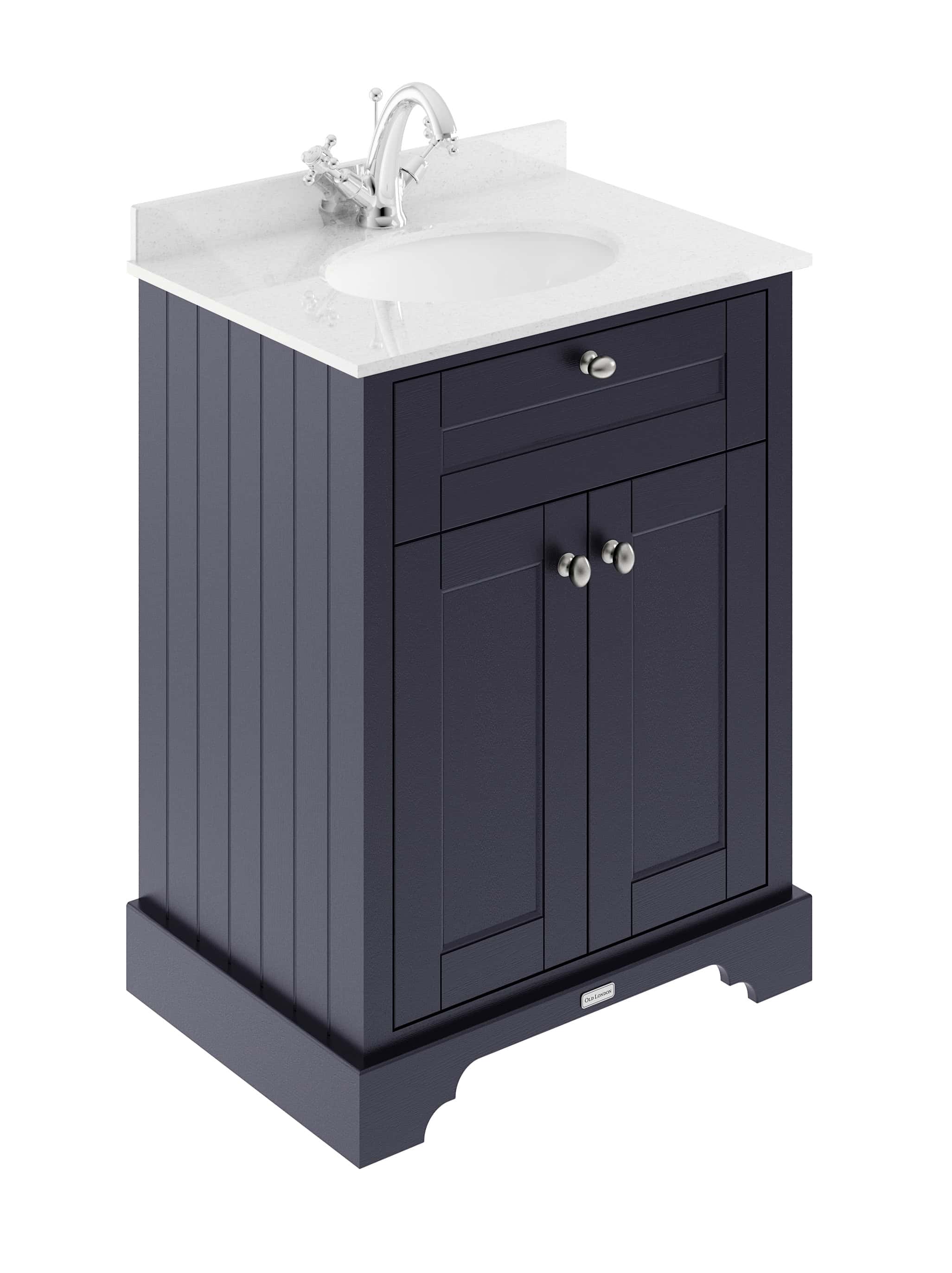 Dark blue bathroom vanity with a white marble countertop and integrated sink, featuring classic beadboard paneling and brushed nickel hardware, ideal for elegant bathroom designs.