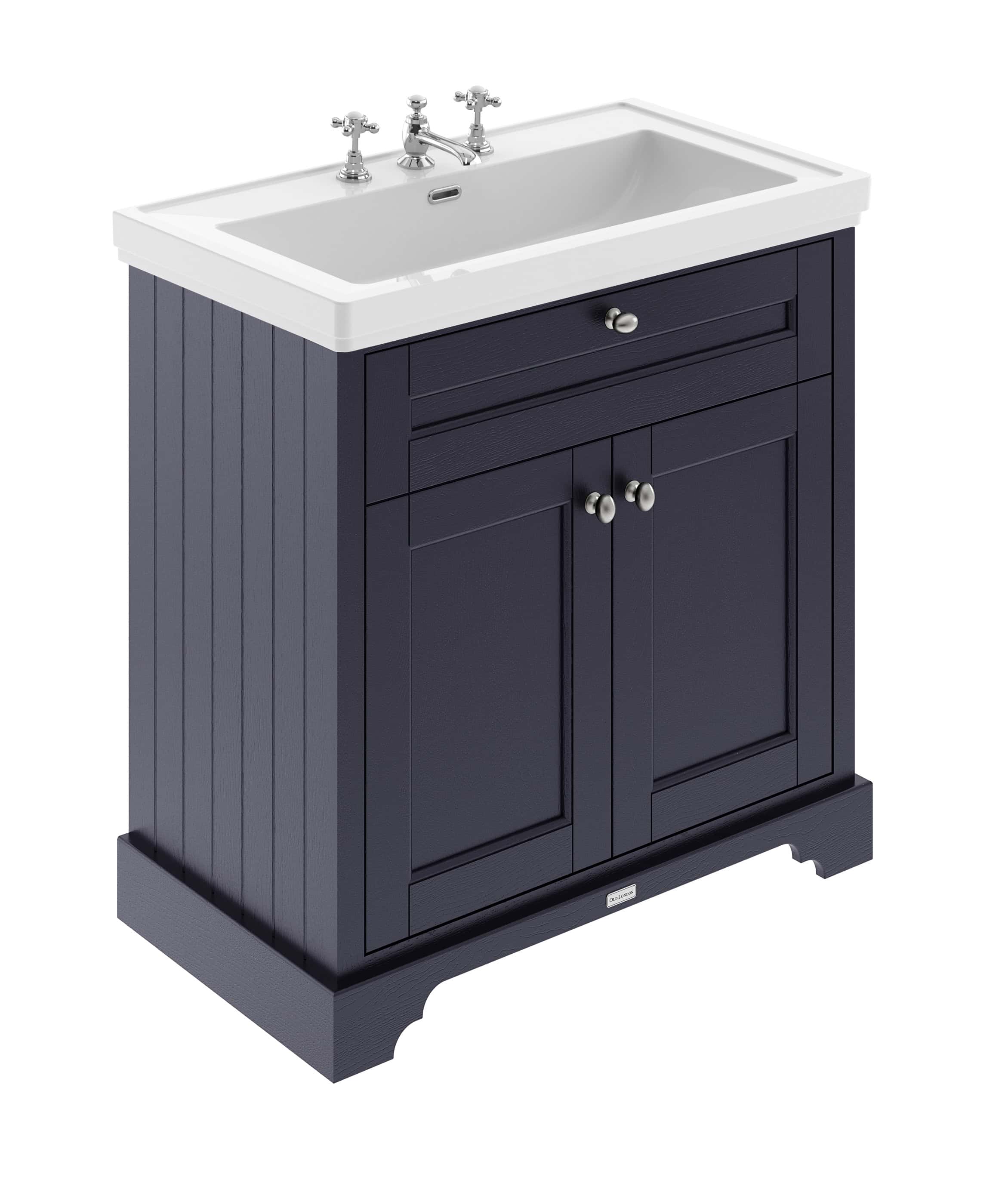 Polished navy bathroom vanity with a classic white ceramic sink and traditional tap fixtures, ideal for vintage-style bathroom remodels.