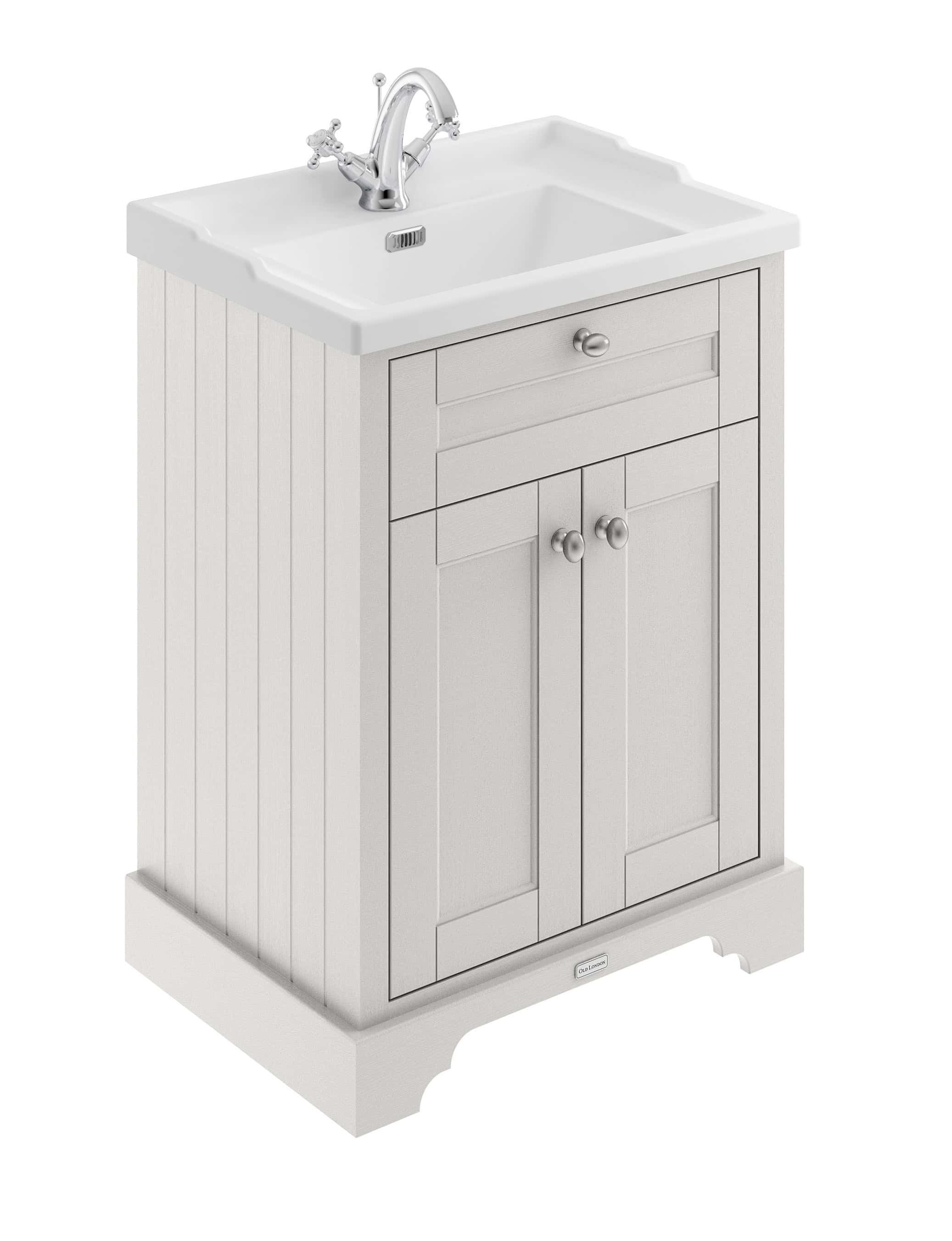 Vintage white bathroom sink vanity with storage cabinet and chrome fixtures, ideal for classic bathroom remodels and organising toiletries.
