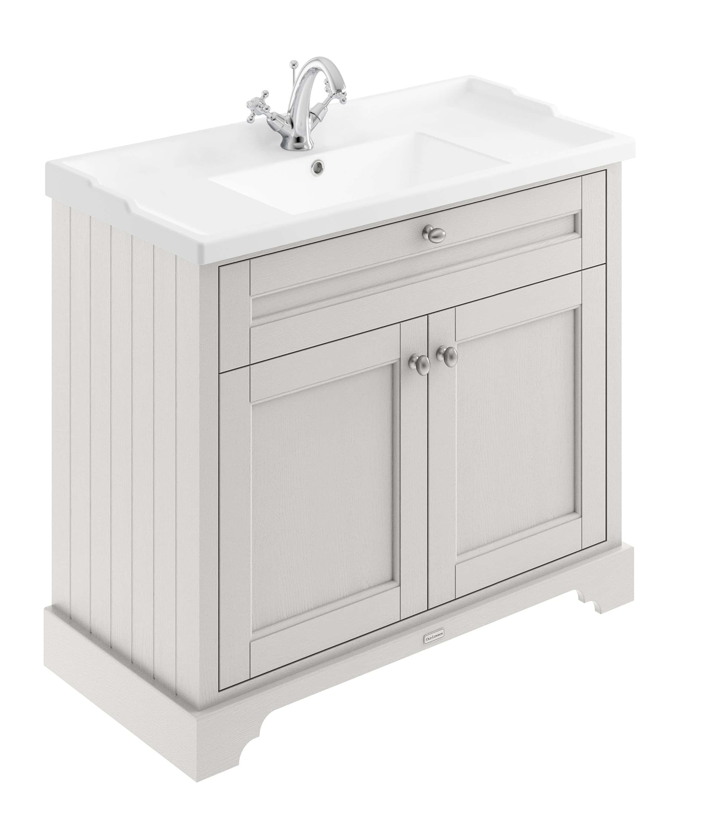 Polished white bathroom vanity with integrated sink, chrome faucet, and cabinet storage, ideal for classic and contemporary bathroom designs.