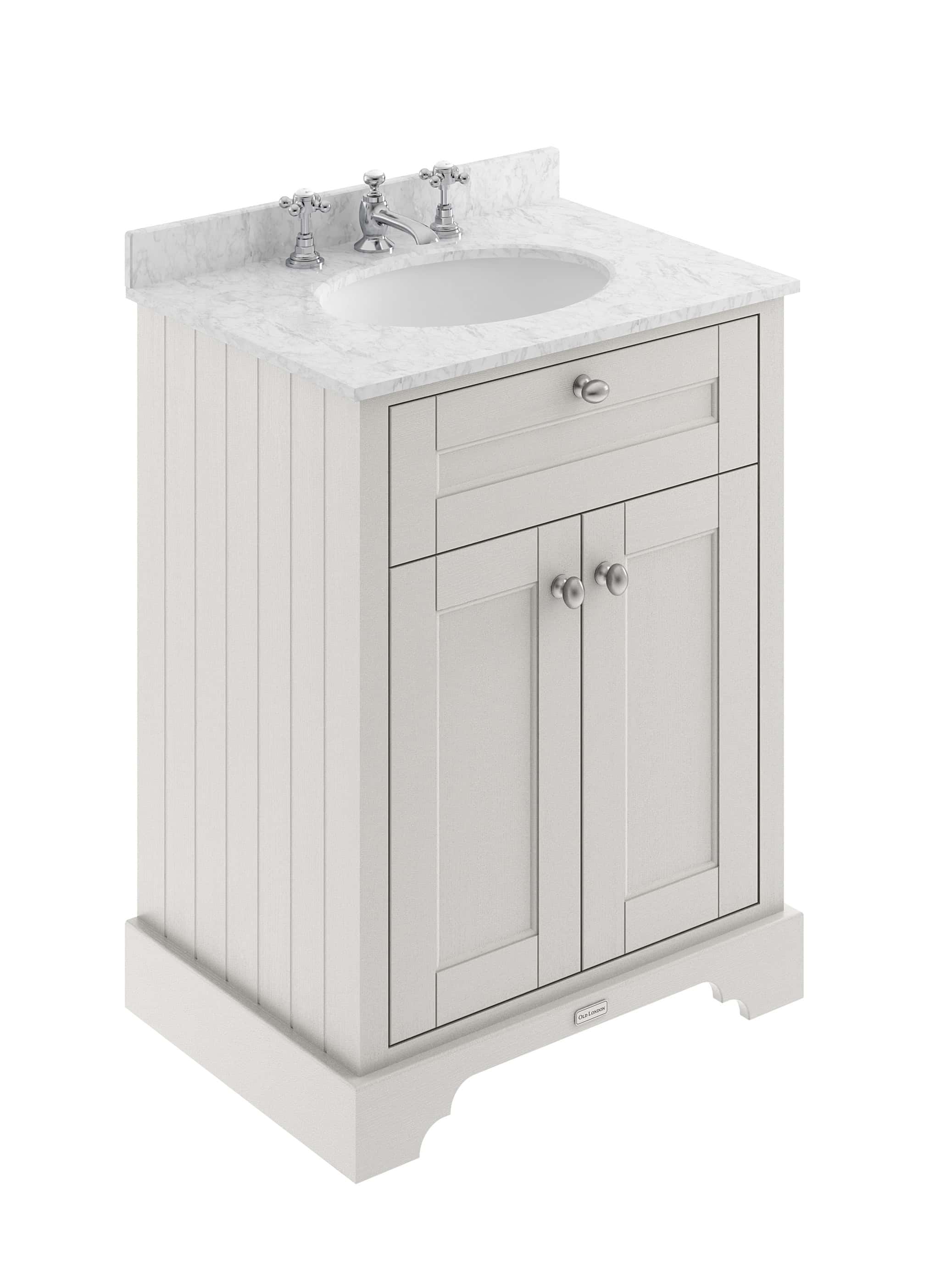 Polished white bathroom vanity with marble countertop, classic style sink, and chrome fixtures, ideal for traditional bathroom decor.