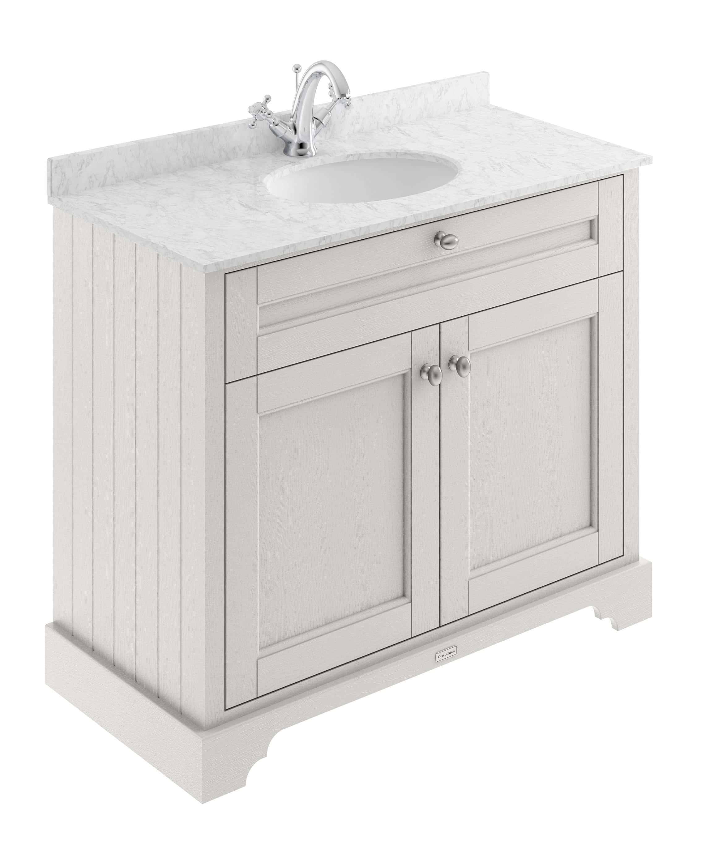 Elegant bathroom vanity with marble countertop and integrated sink, featuring classic beadboard panel detailing and brushed nickel hardware, perfect for traditional bathroom design.