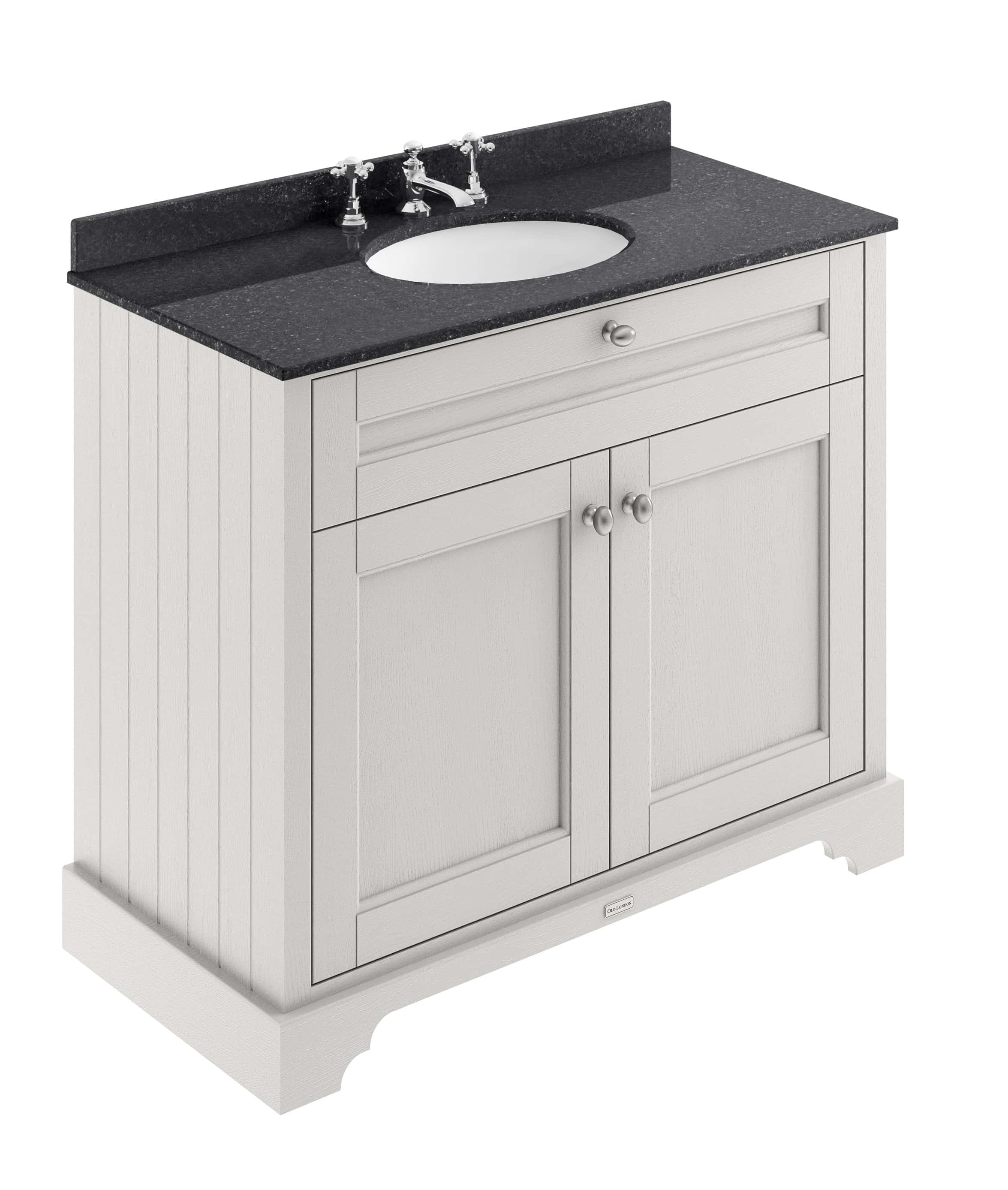 Elegant bathroom vanity unit with a black granite countertop, white wooden cabinet and classic chrome taps, perfect for contemporary and traditional bathroom interiors.