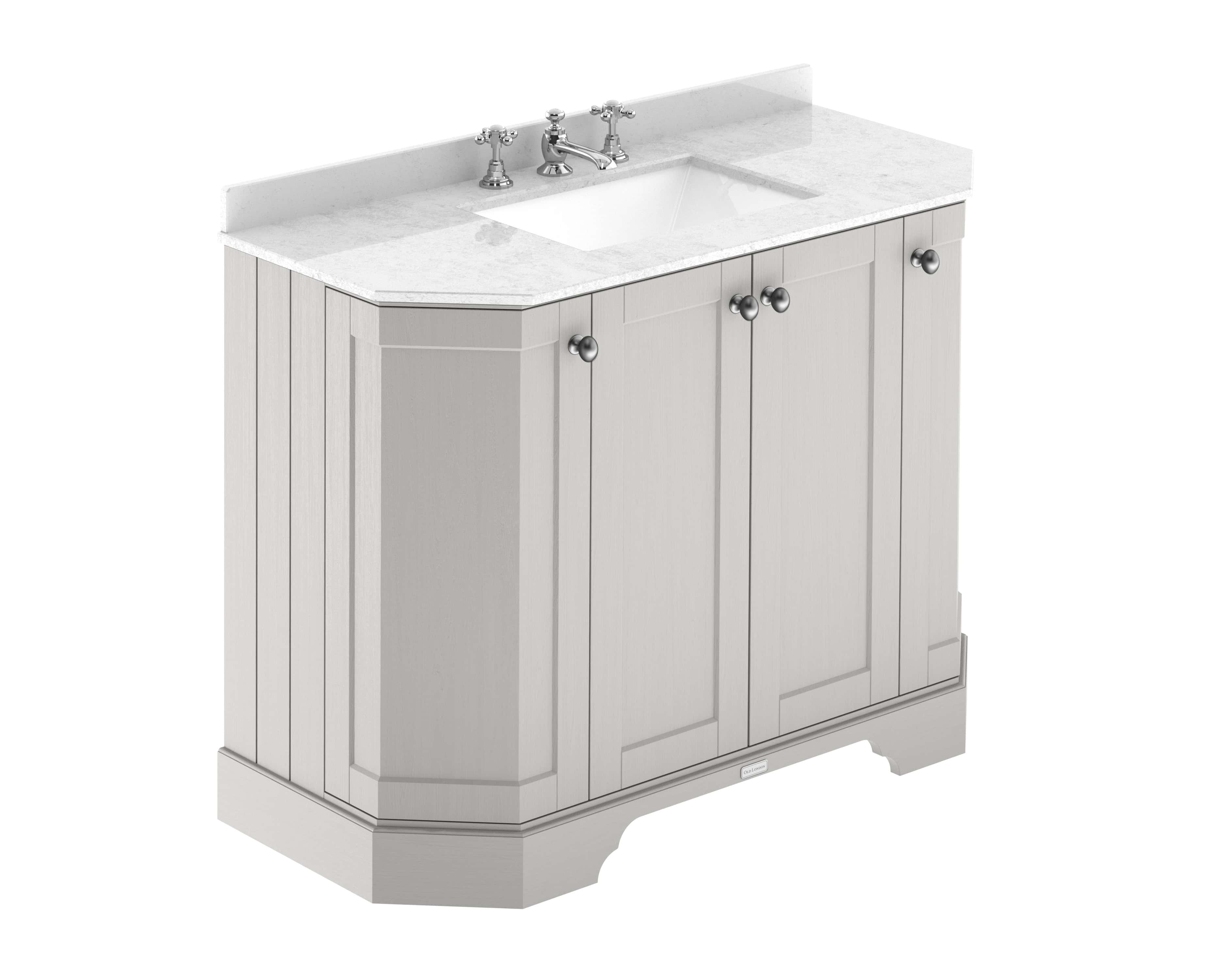 Polished white bathroom vanity with marble top, traditional design, with cabinets and chrome handles, suitable for elegant bathroom renovation.