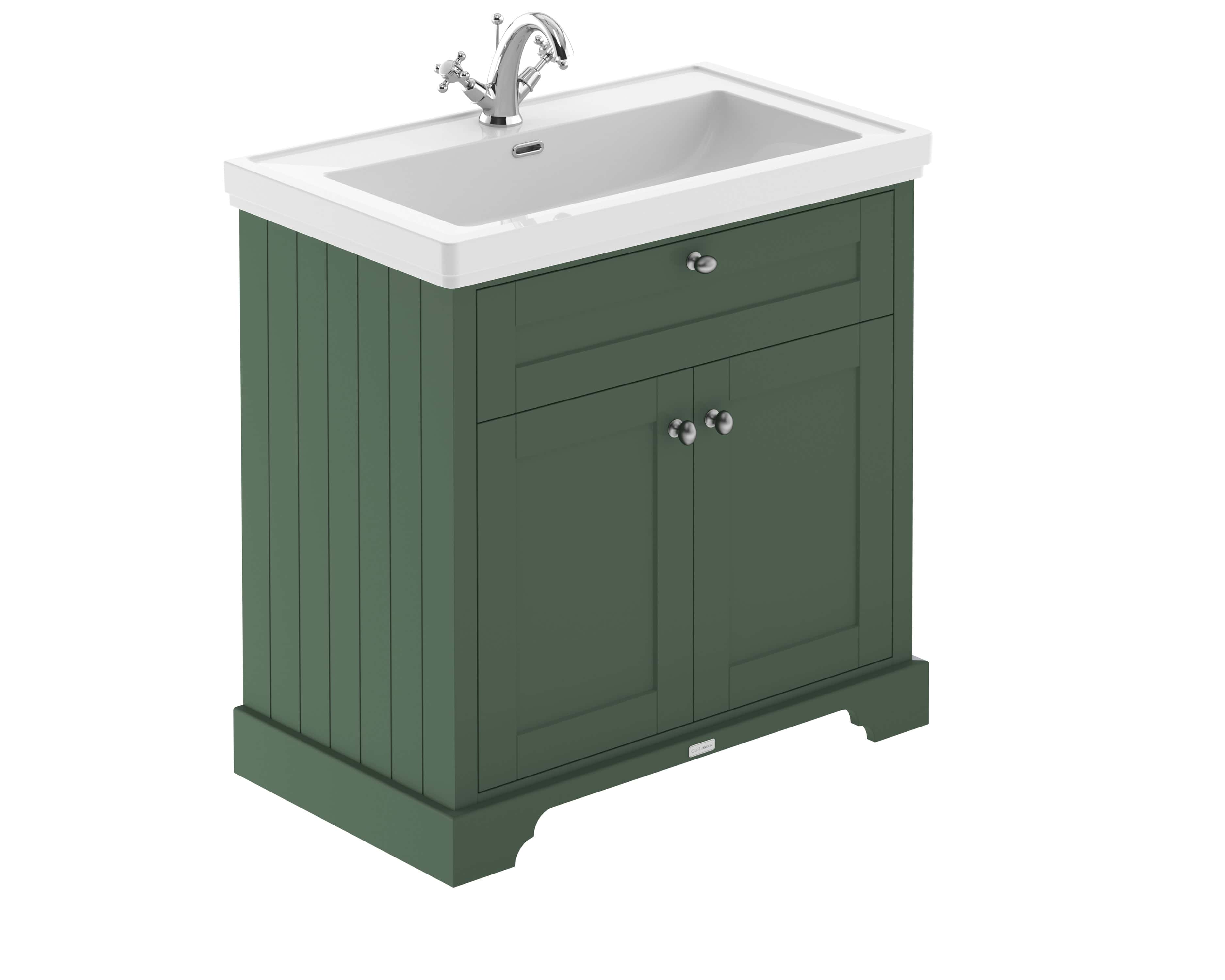 Polished green bathroom vanity with white ceramic sink and chrome tap, perfect for classic and modern bathroom designs.