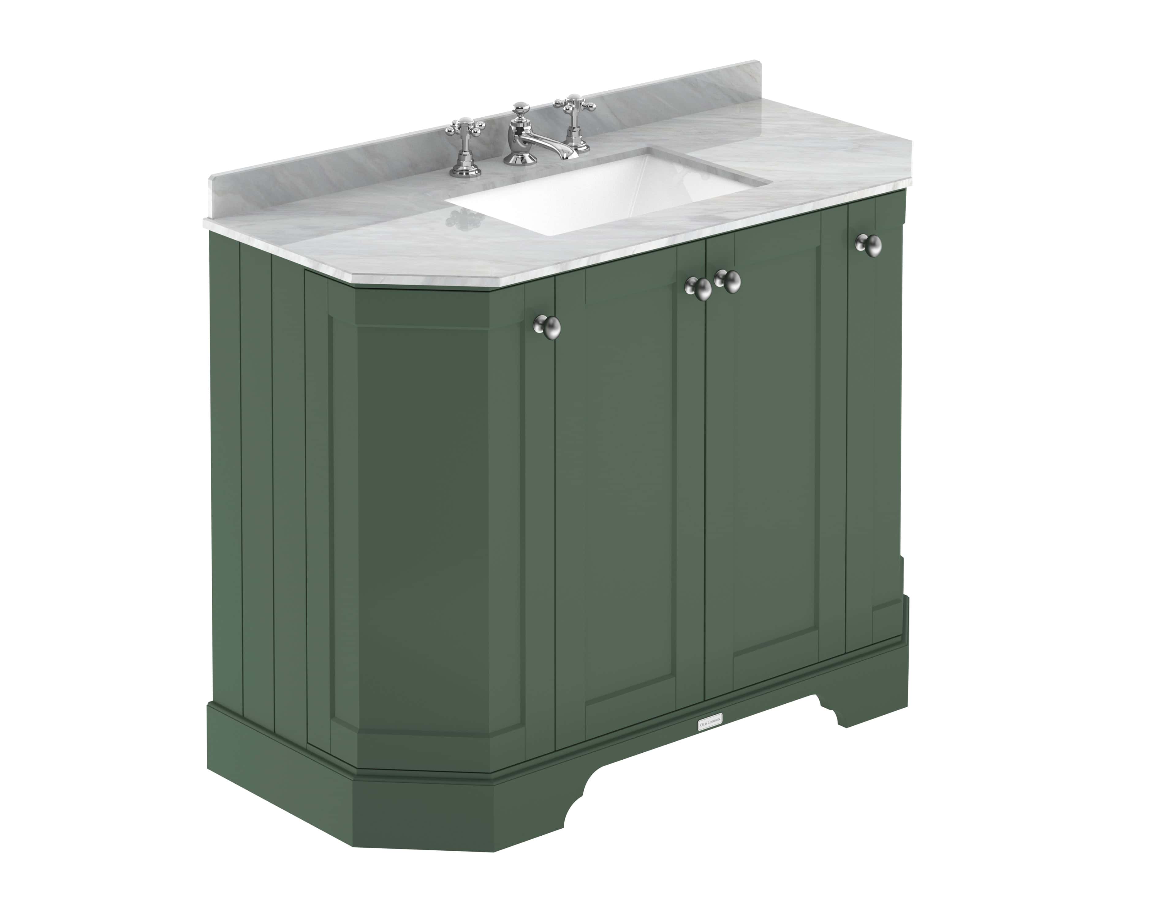 Elegant bathroom vanity with marble top and traditional brass taps, finished in deep green cabinetry, ideal for classic bathroom renovations and stylish bathroom storage solutions.