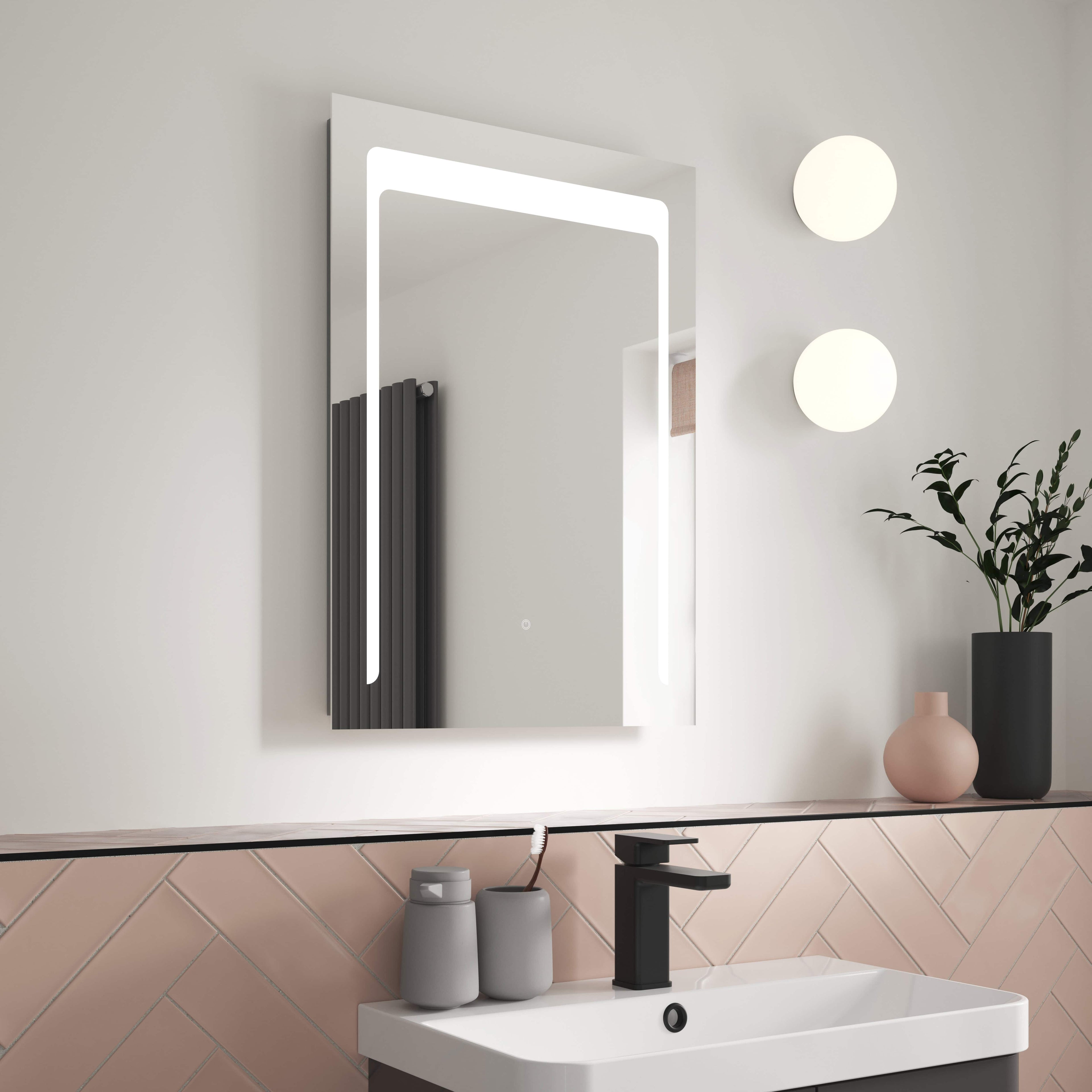 Stylish modern bathroom mirror with built-in LED lighting, minimalist black faucet, and contemporary wall light fixtures creating a sleek, functional space ideal for bathroom décor.